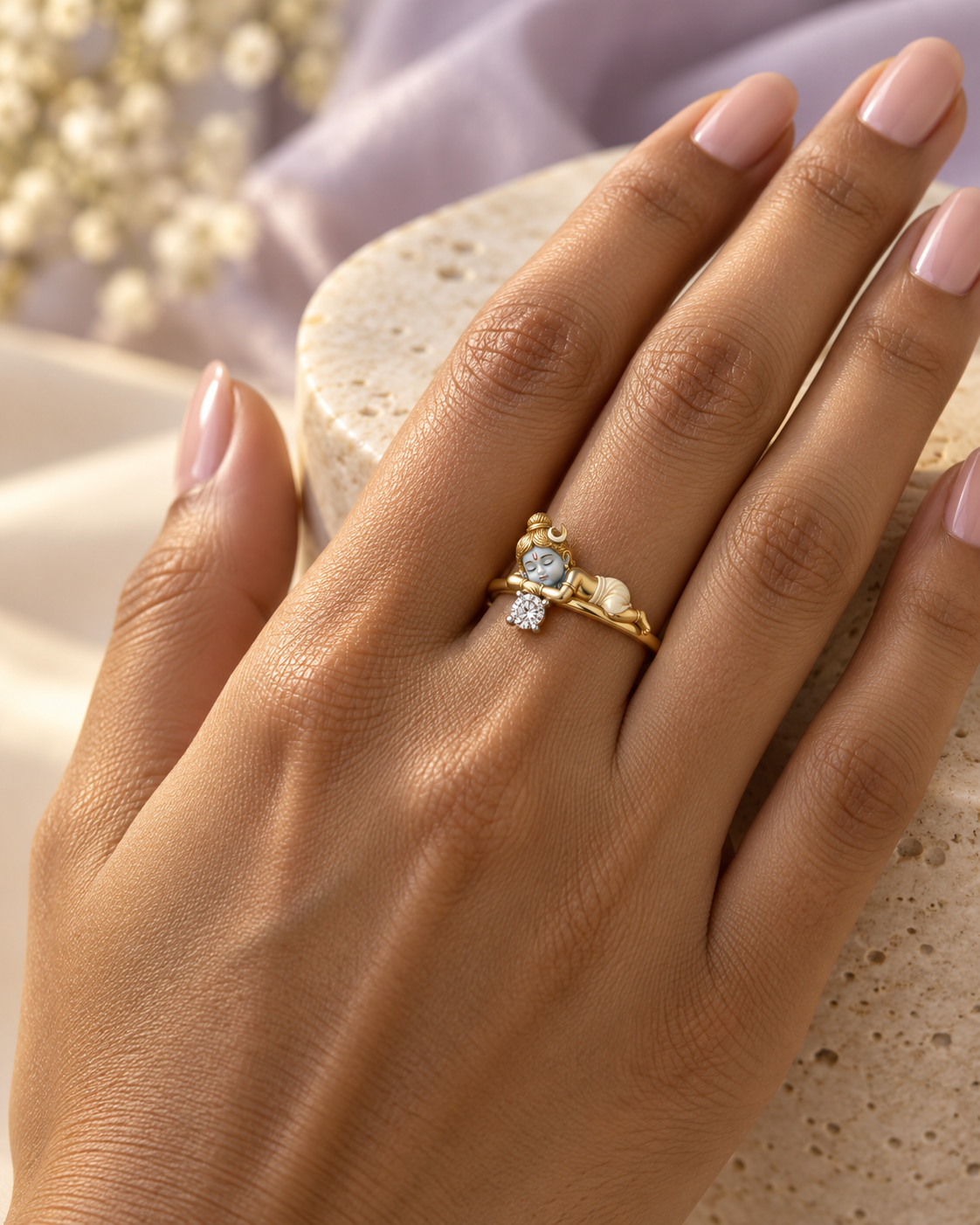 Bal Shiva Nidra ring – baby Shiva asleep on the band with crescent moon and red tilak beside a lab grown diamond solitaire, worn on the ring finger