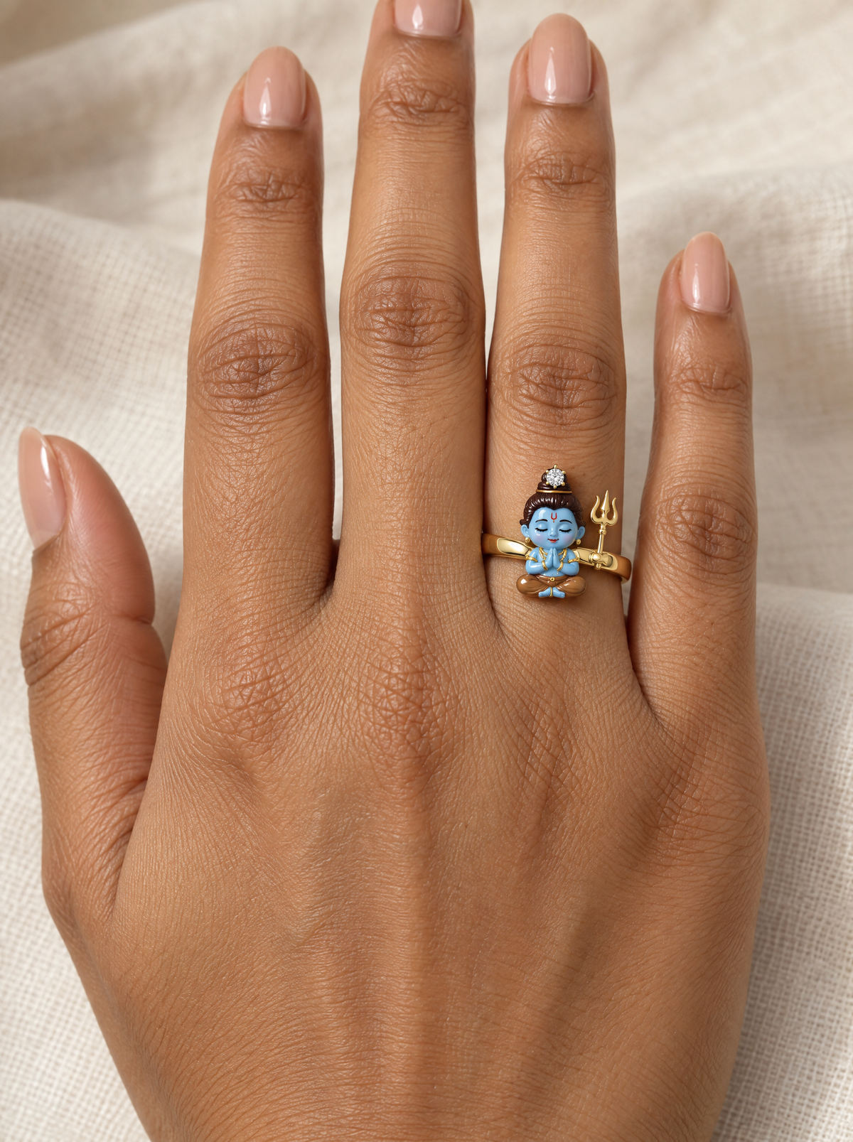 Bal Shiva Bagambar ring – brown tiger-skin dhoti, diamond on top of his jata and a gold trishul, worn on the ring finger