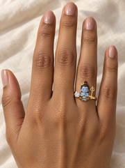Bal Shiva Shambhu ring – seated between a lab grown diamond solitaire and a gold trishul, crescent moon in his jata, worn on the ring finger