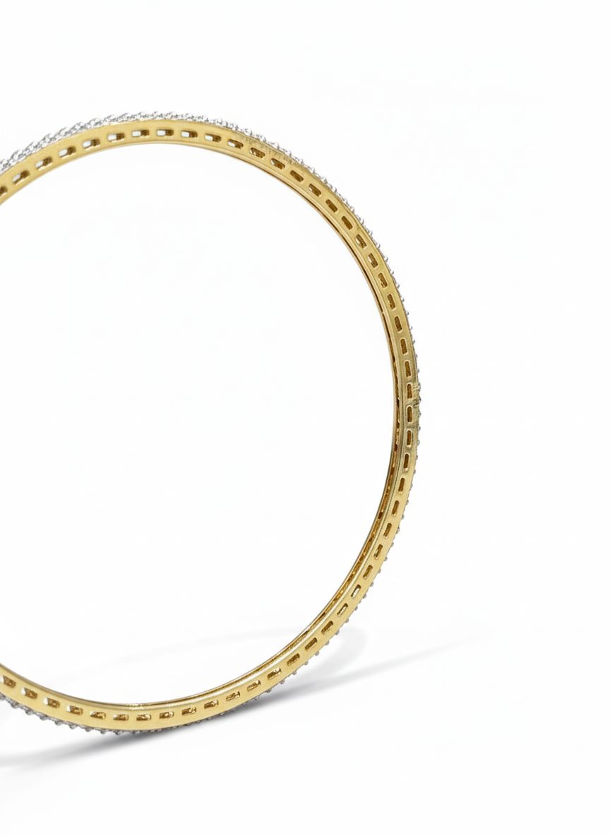 Close-up of Celvoria Rise Round Lab Diamond Solitaire Bangle in 14K Yellow Gold by Fiona Diamonds