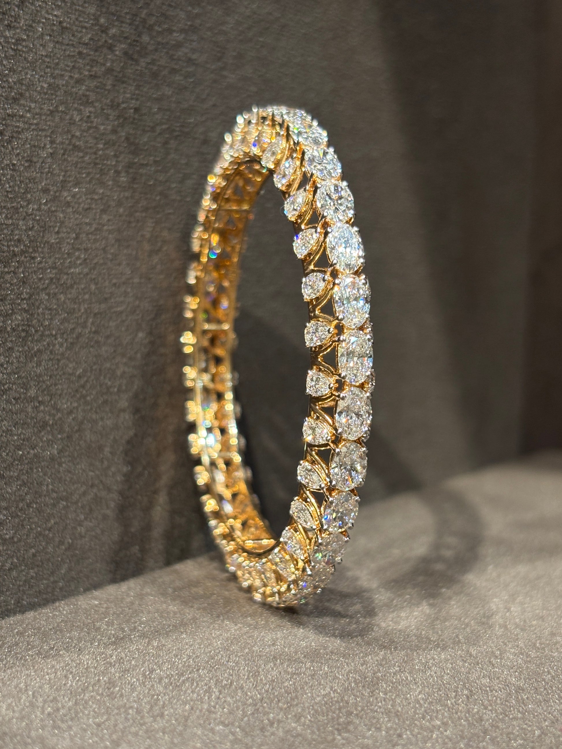 Close-up of Celeste Arc Oval Lab Diamond Solitaire Bangle in 14K Rose Gold by Fiona Diamonds