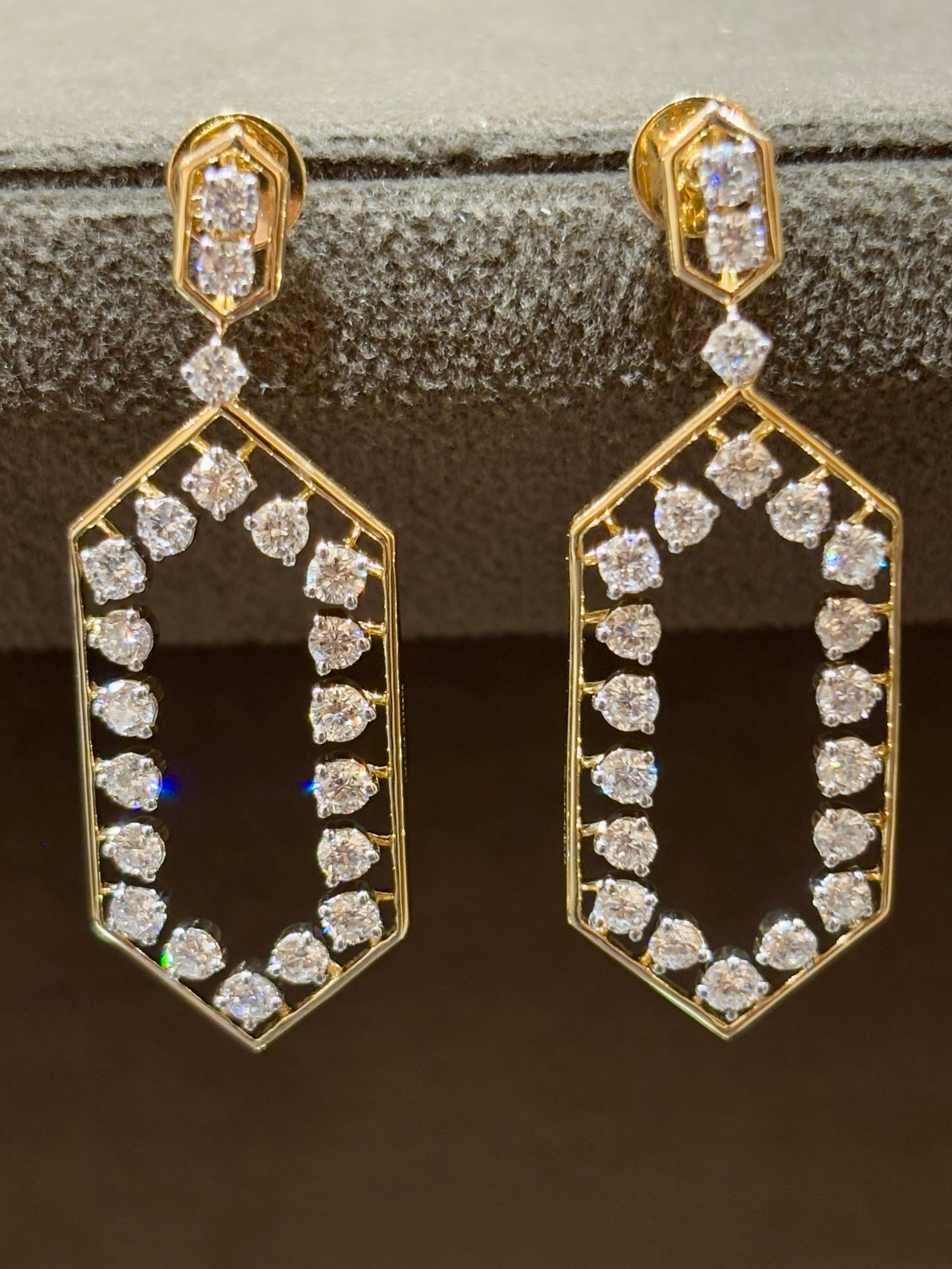 Close-up of Oressa Field Round Lab Diamond Dangler Earrings in 18K Yellow Gold by Fiona Diamonds