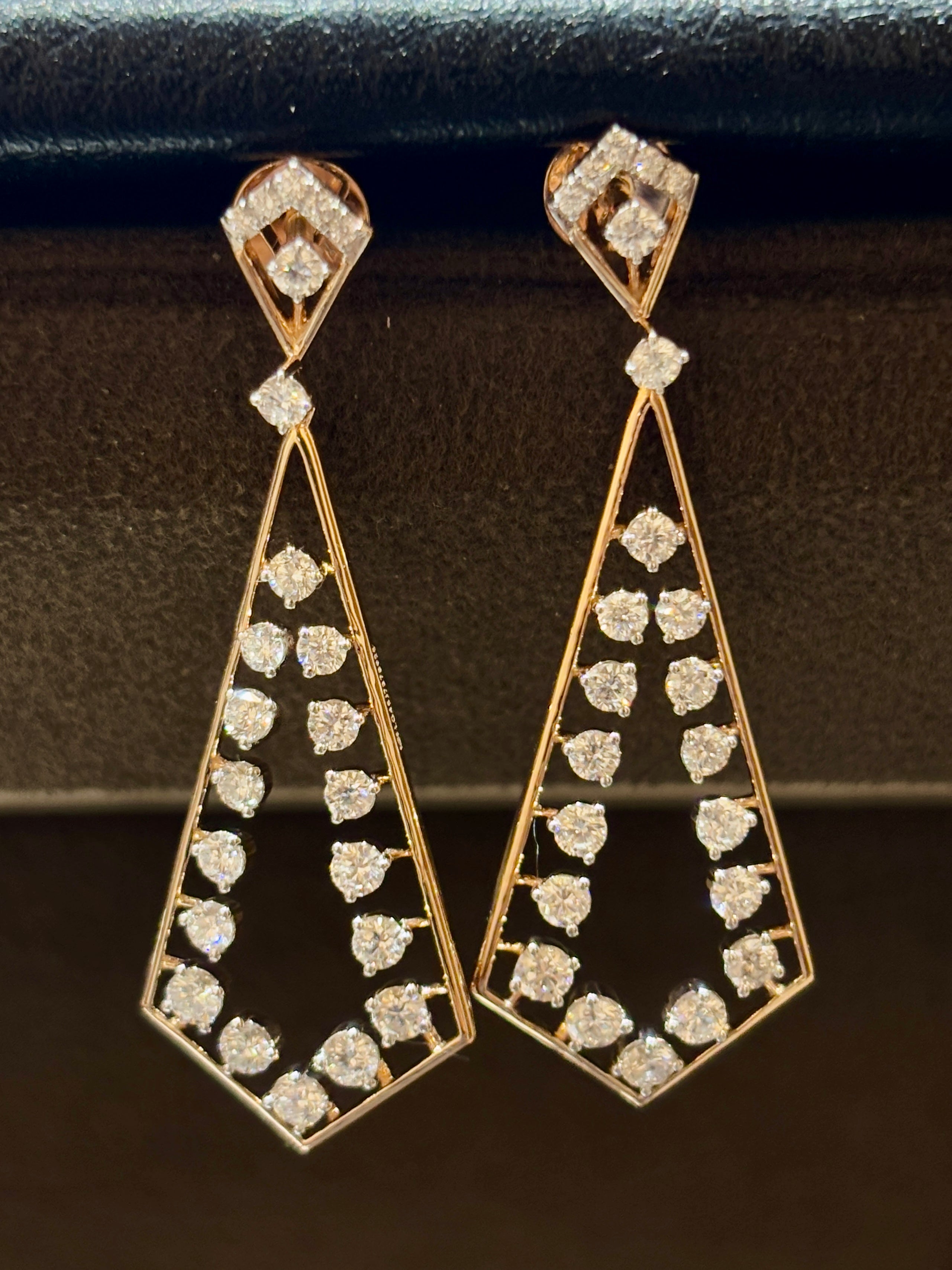 Close-up of Kaelin Whisper Round Lab Diamond Dangler Earrings in 18K Rose Gold by Fiona Diamonds