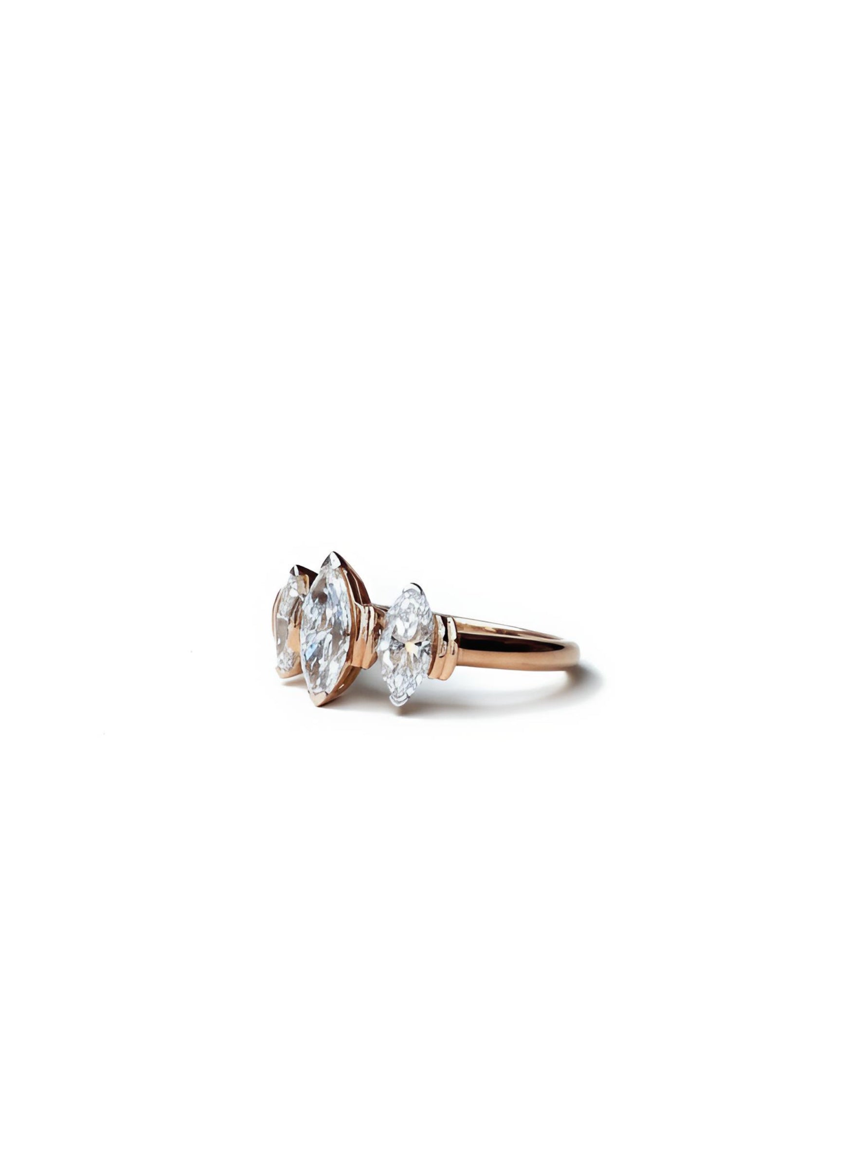 Side view of Xynexia Band Marquise Lab Diamond Three Stone Ring in 14K Rose Gold - Fiona Diamonds