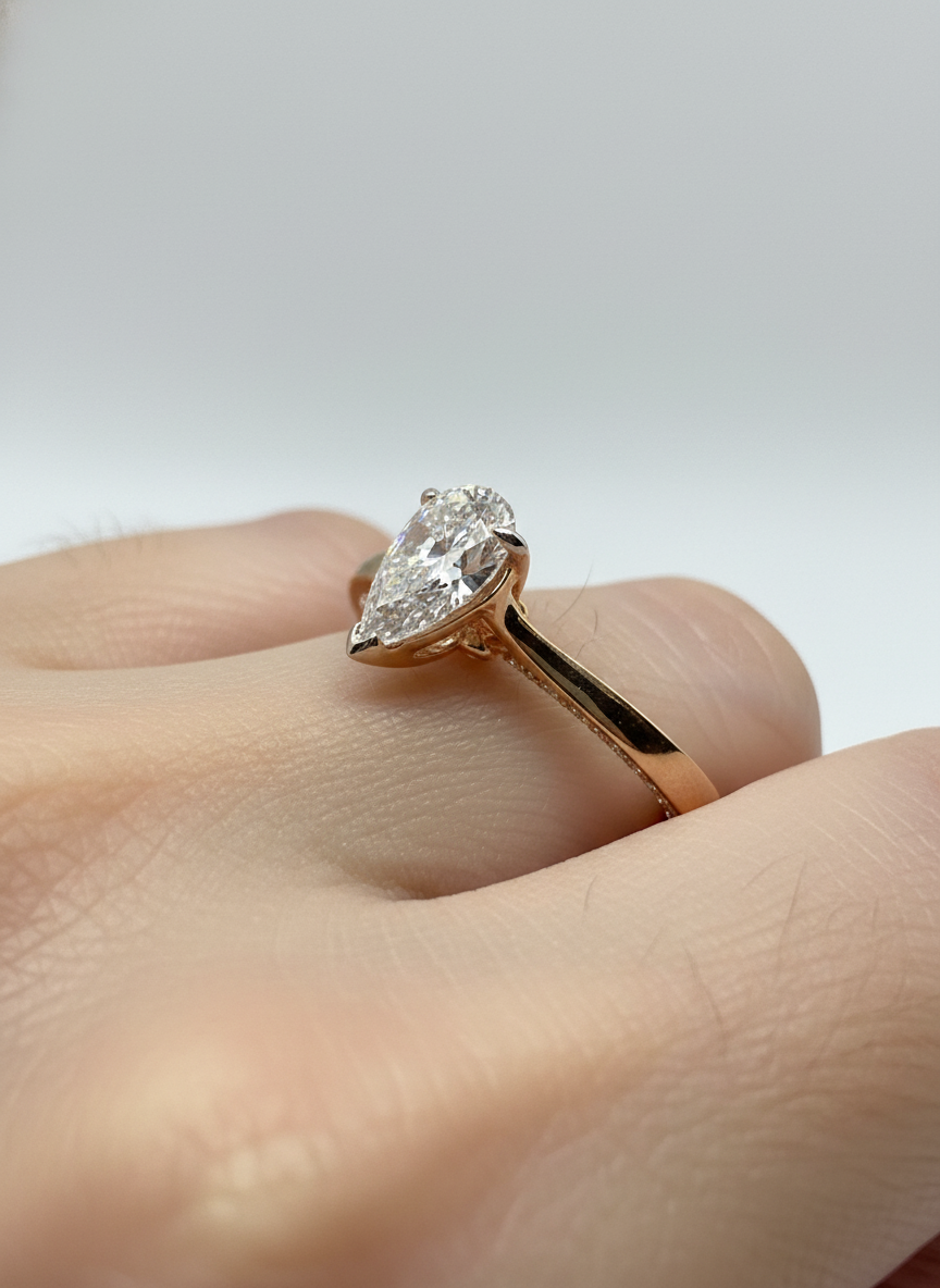 Fiona Diamonds Ulric Glow Pear Lab Diamond Classic Solitaire Ring in 18K Yellow Gold on hand
