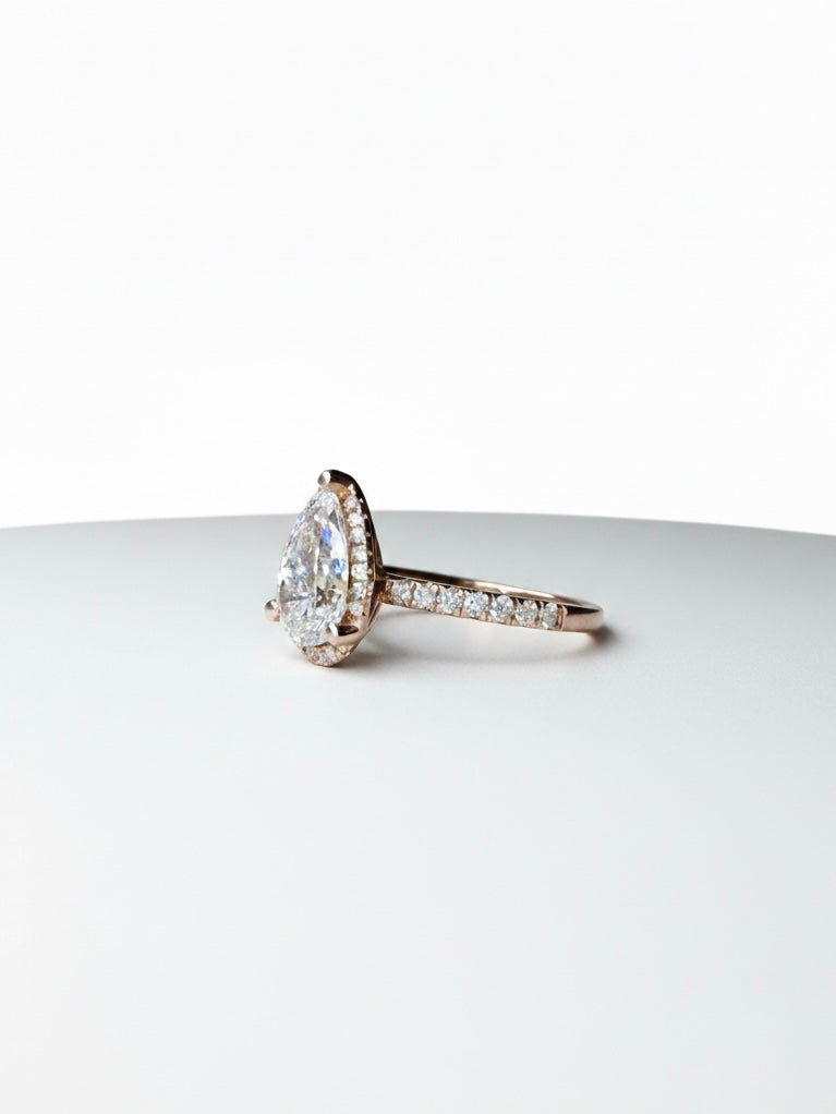 Side view of Xyphrix Band Pear Lab Diamond Halo Ring in 14K Rose Gold - Fiona Diamonds