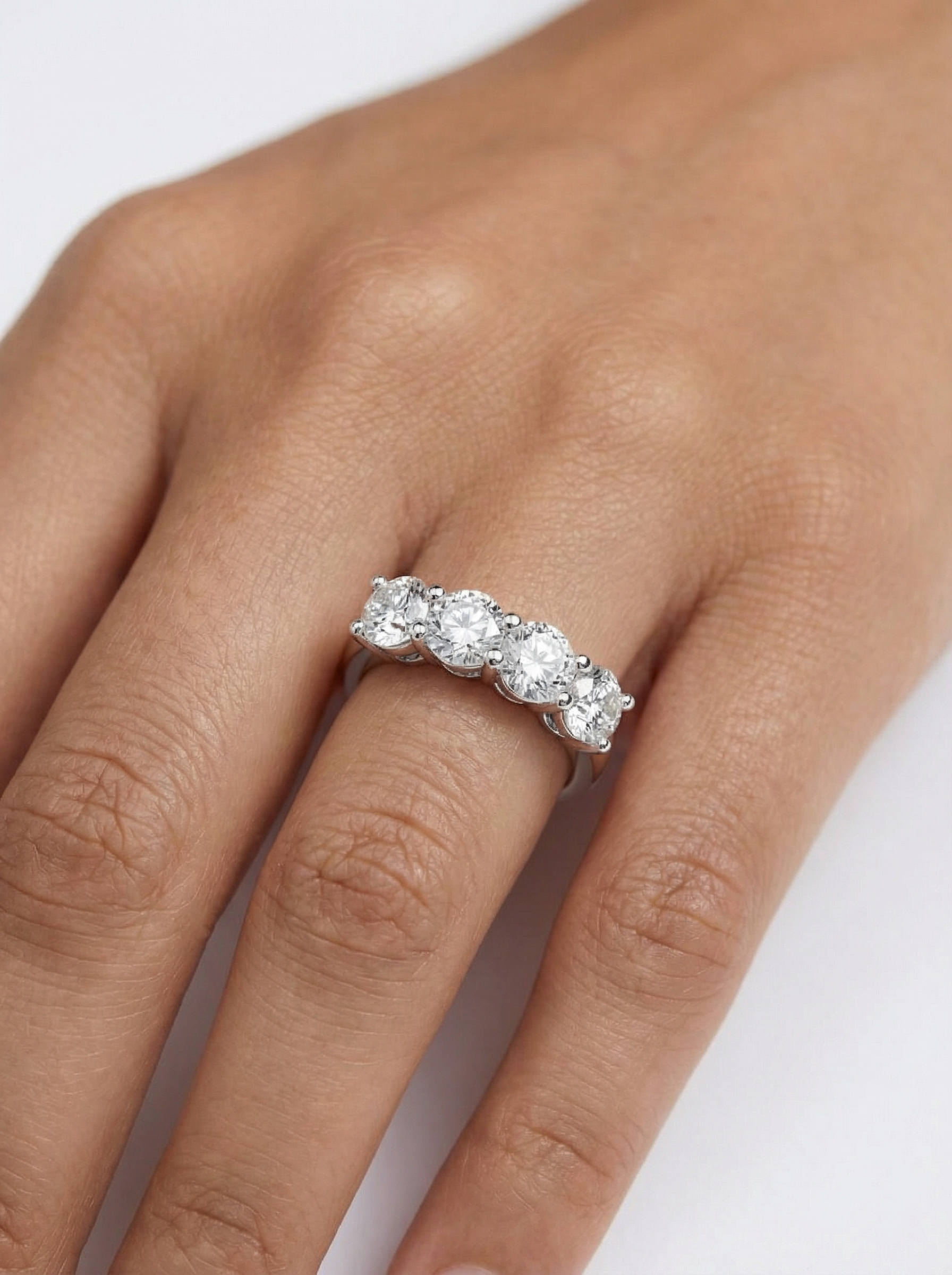 Close-up of Zyphora Crest Round Lab Diamond Eternity Ring set in 18K White Gold by Fiona Diamonds