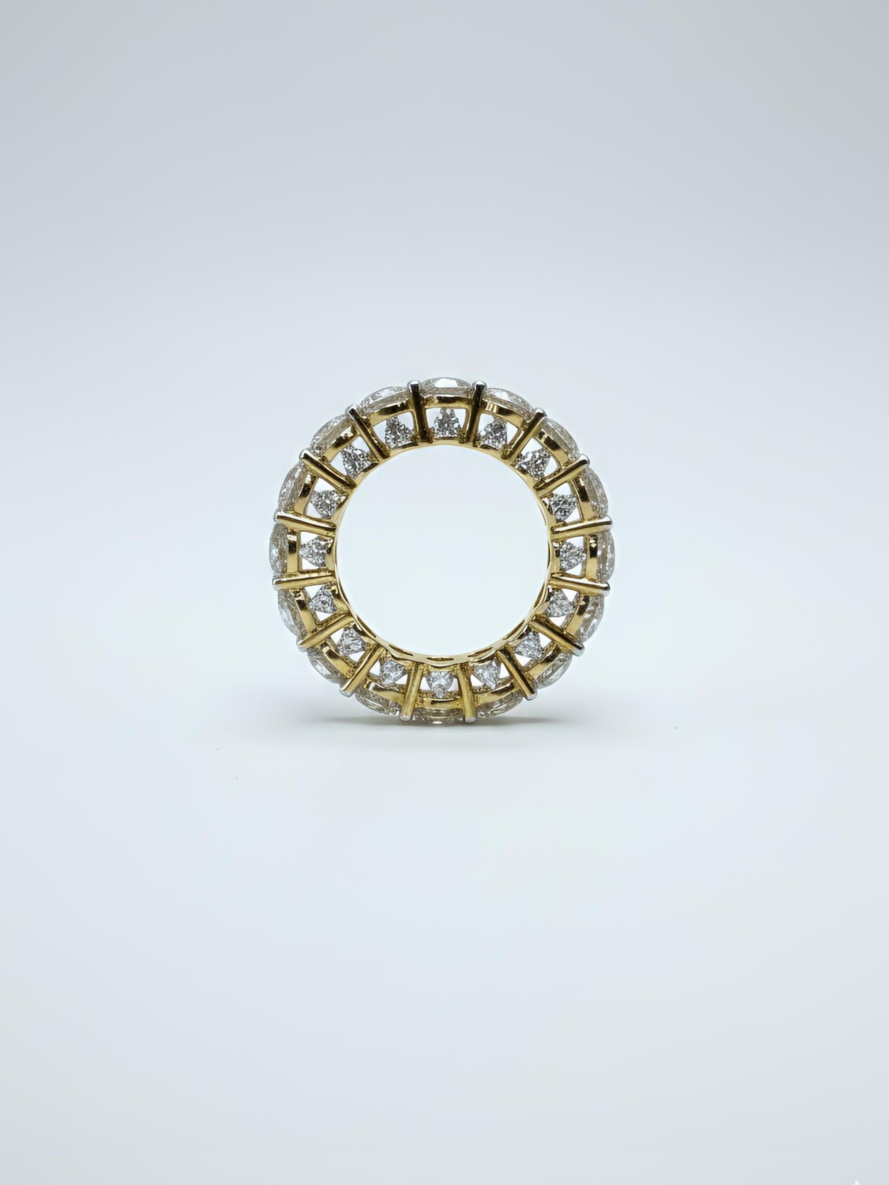 Close-up of Avyphora Strand Round Lab Diamond Eternity Ring set in 14K Yellow Gold by Fiona Diamonds