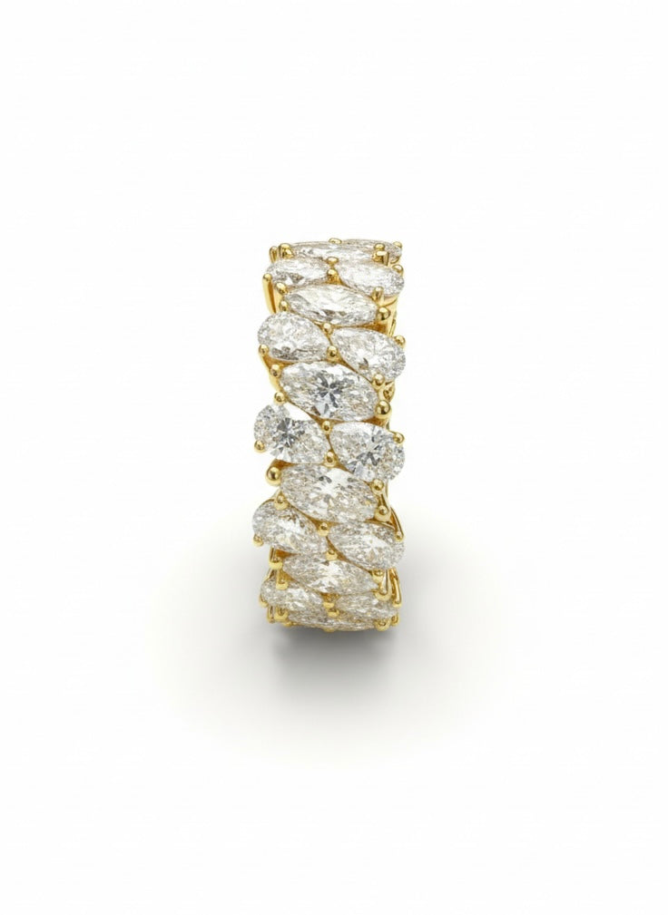 Side view of Avyxor Curve Pear Lab Diamond Eternity Ring in 18K Yellow Gold - Fiona Diamonds