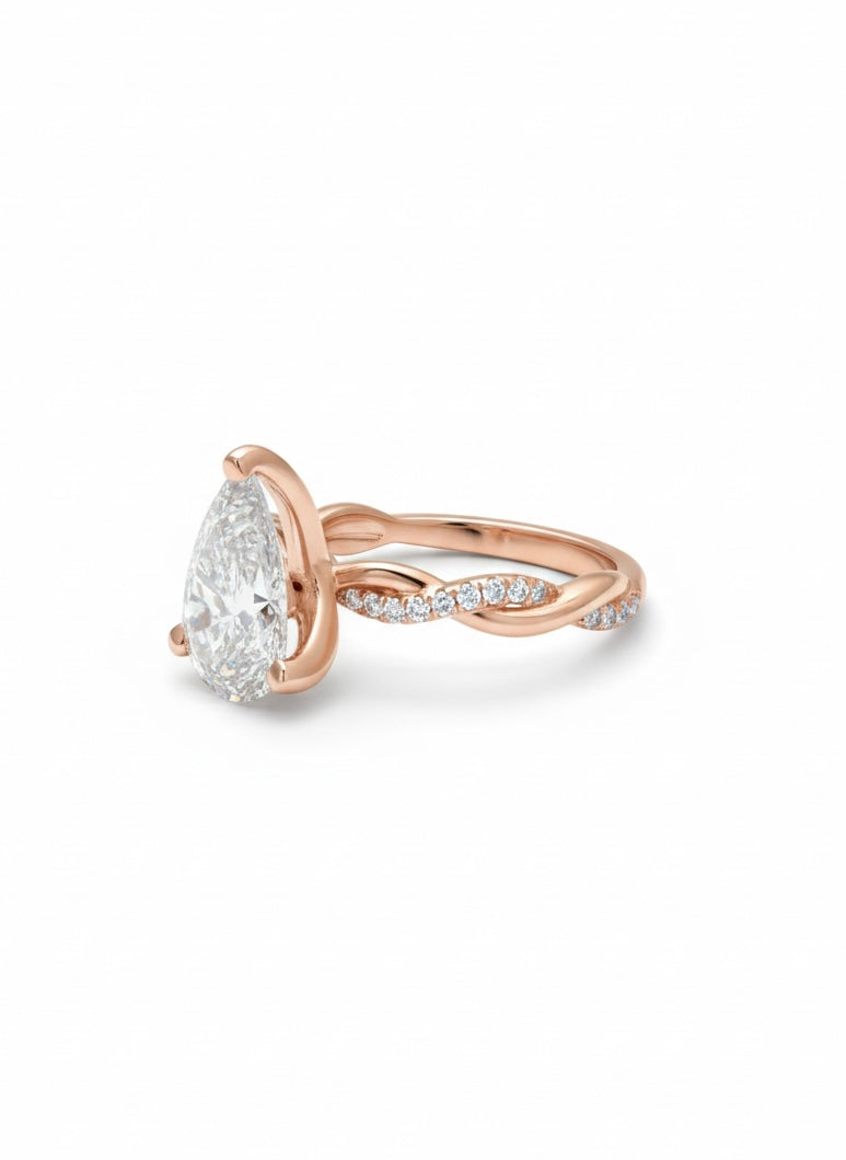 Side view of Qirelle Frame Pear Lab Diamond Side Stone Solitaire Ring in 18K Rose Gold  Fiona Diamonds