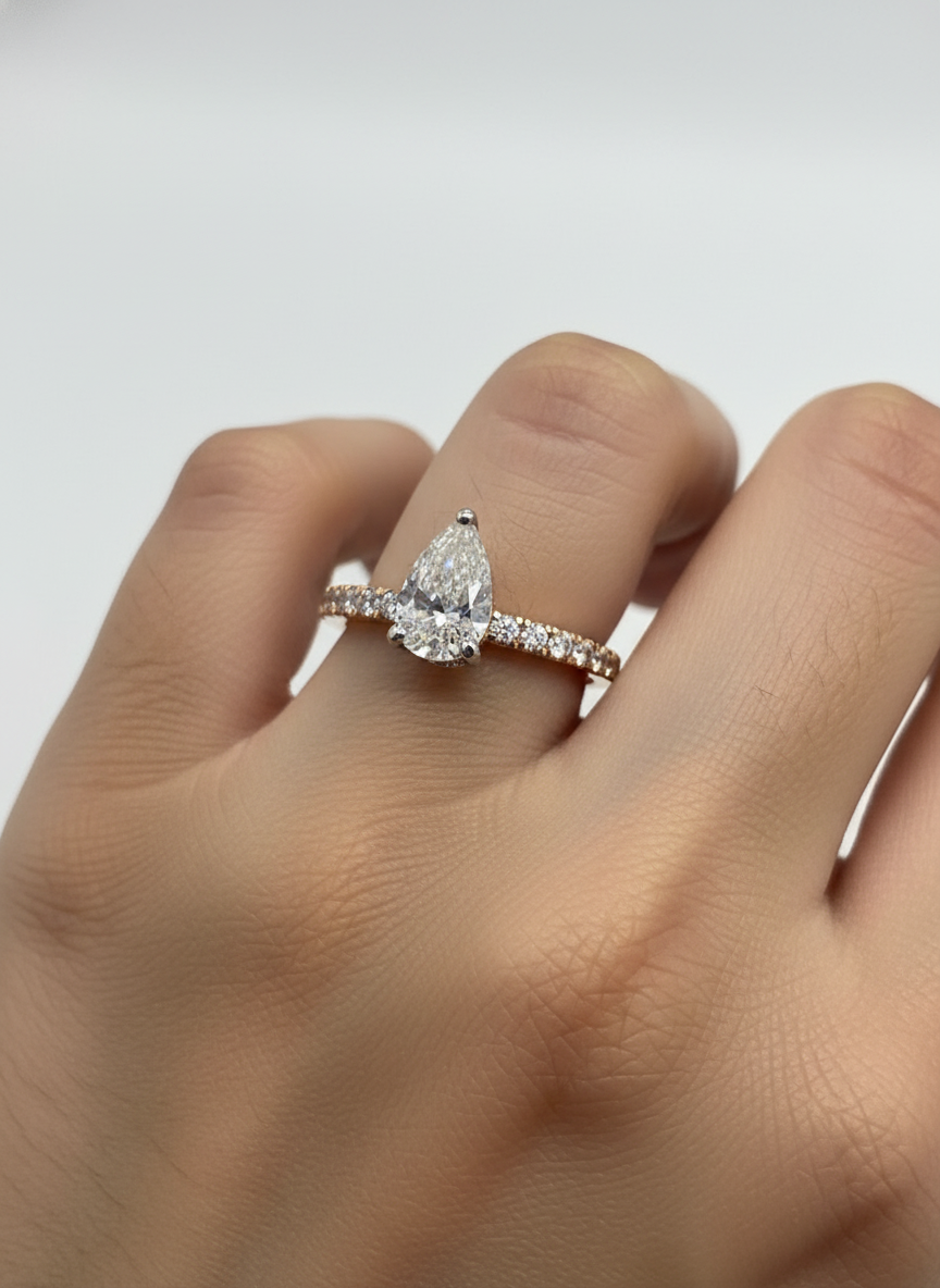 Side view of Orbit Crown Pear Lab Diamond Side Stone Solitaire Ring in 18K Rose Gold  Fiona Diamonds