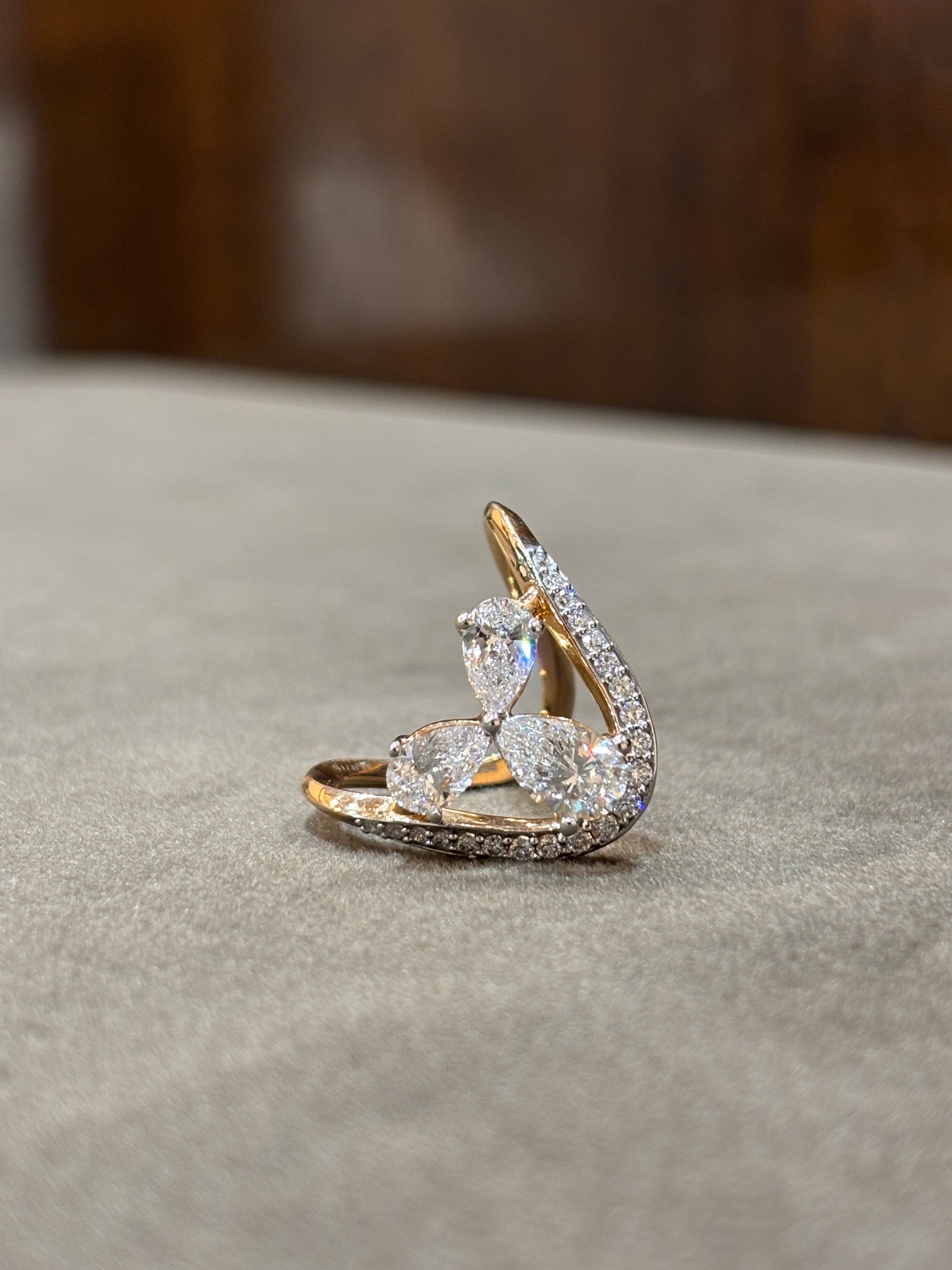 Side view of Crystal Mirage Pear Lab Diamond Designer Ring in 18K Rose Gold - Fiona Diamonds