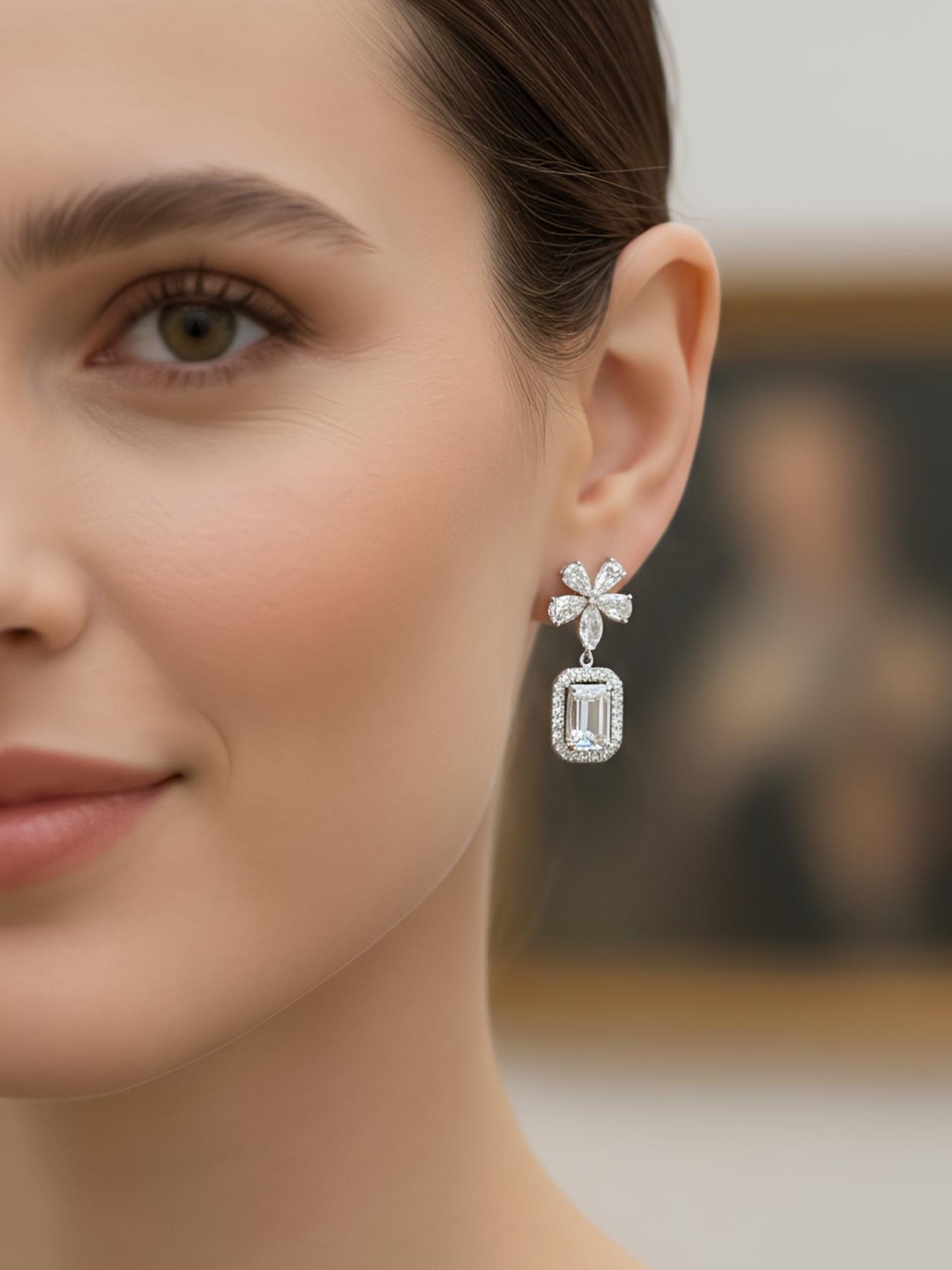Close-up of Norielle Fawn Emerald Lab Diamond Drop Earrings in 18K White Gold by Fiona Diamonds