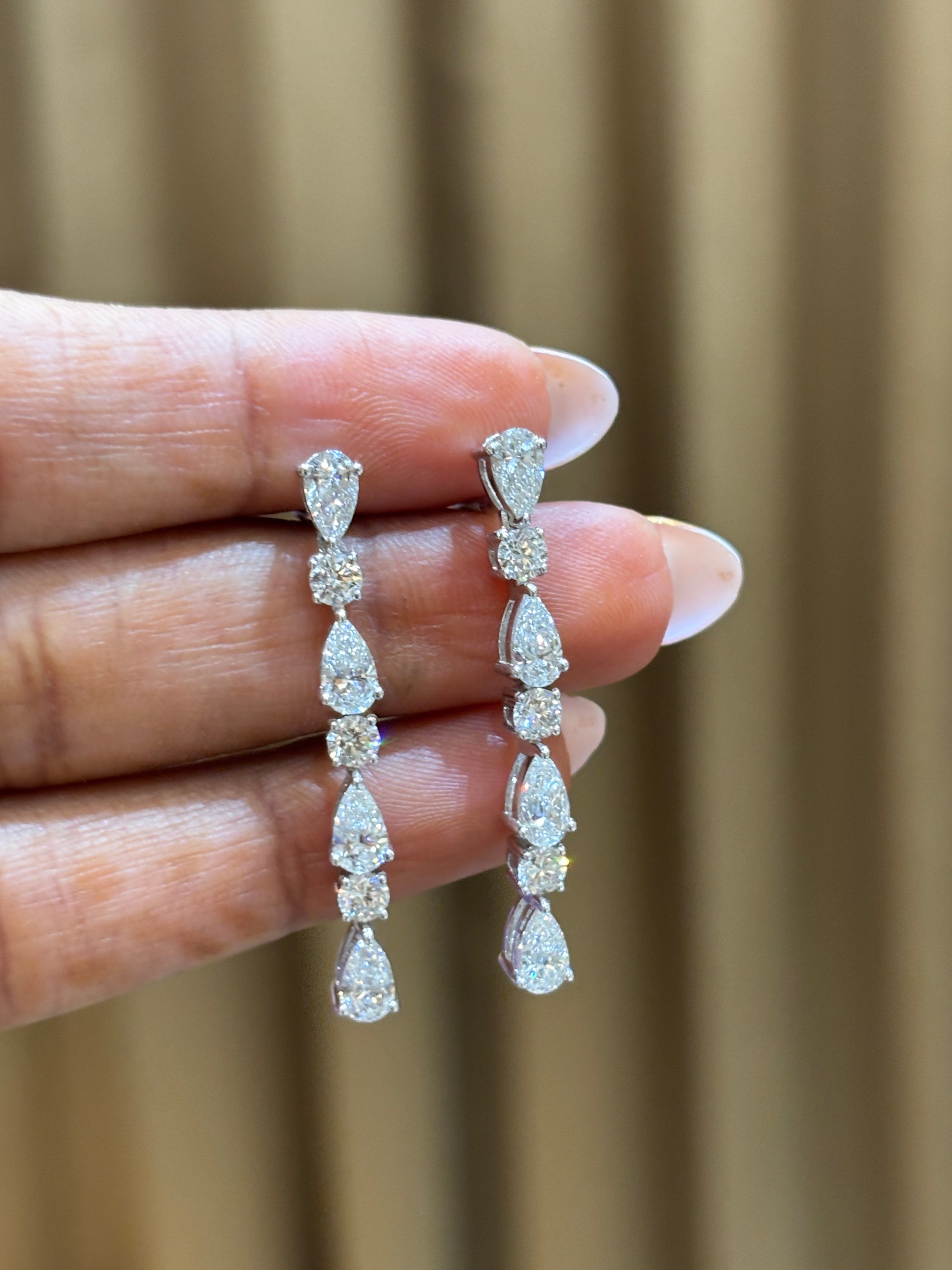 Side view of Divine Cascade Pear Lab Diamond Dangler Earrings in 18K White Gold - Fiona Diamonds
