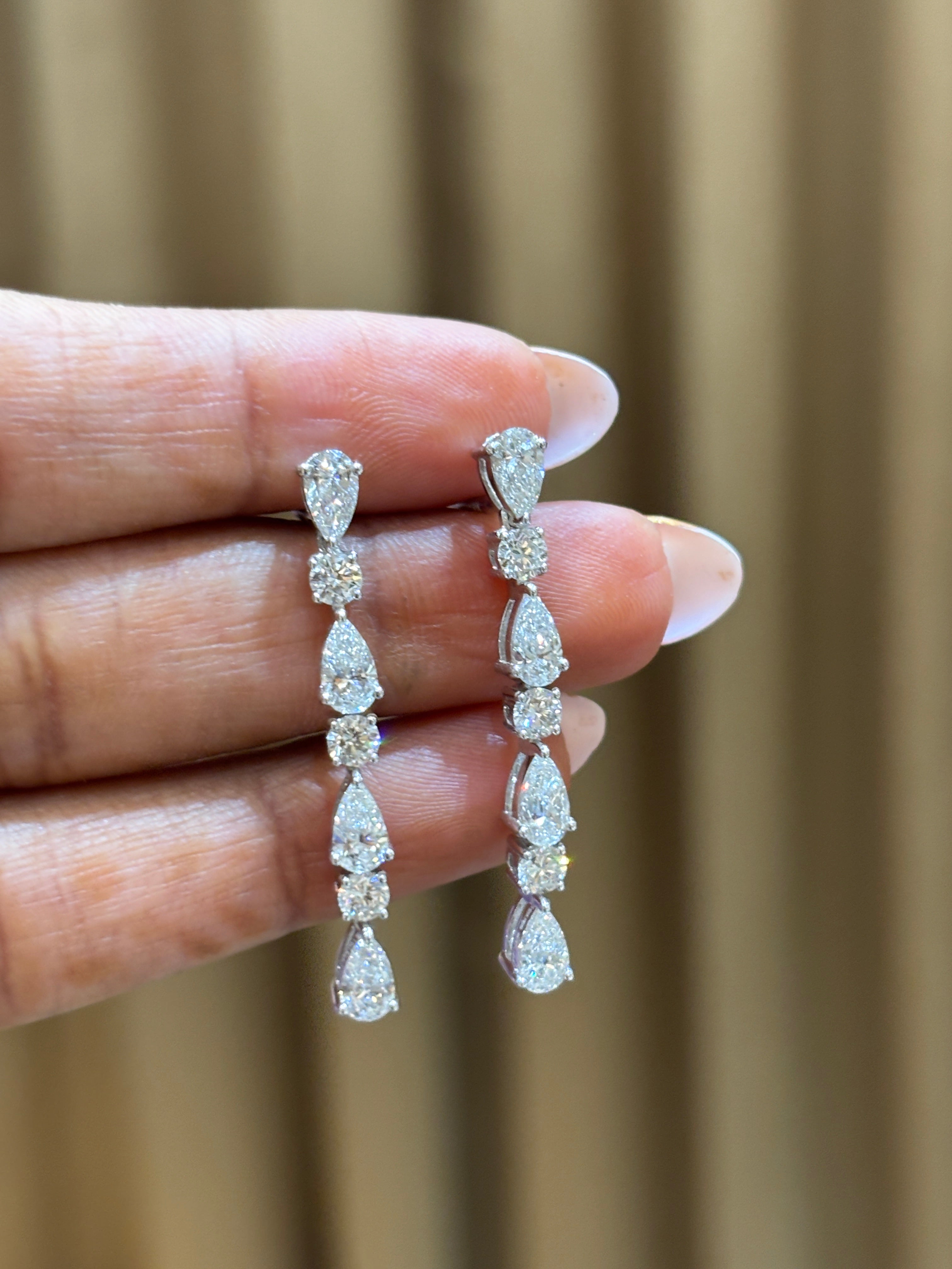 Side view of Divine Cascade Pear Lab Diamond Dangler Earrings in 18K White Gold - Fiona Diamonds