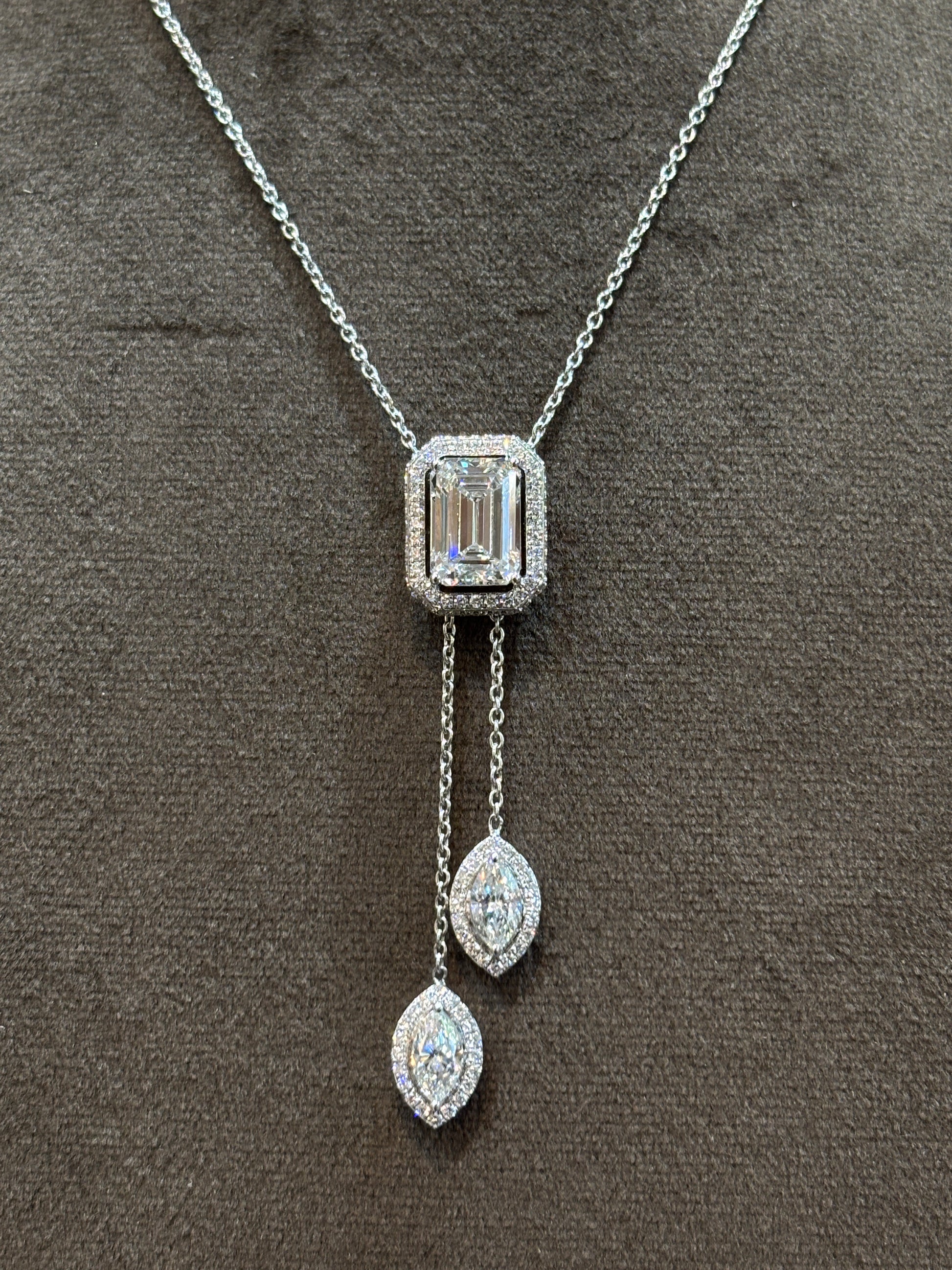 Close-up of Secret Halo Emerald Lab Diamond Chain Necklace in 18K White Gold by Fiona Diamonds