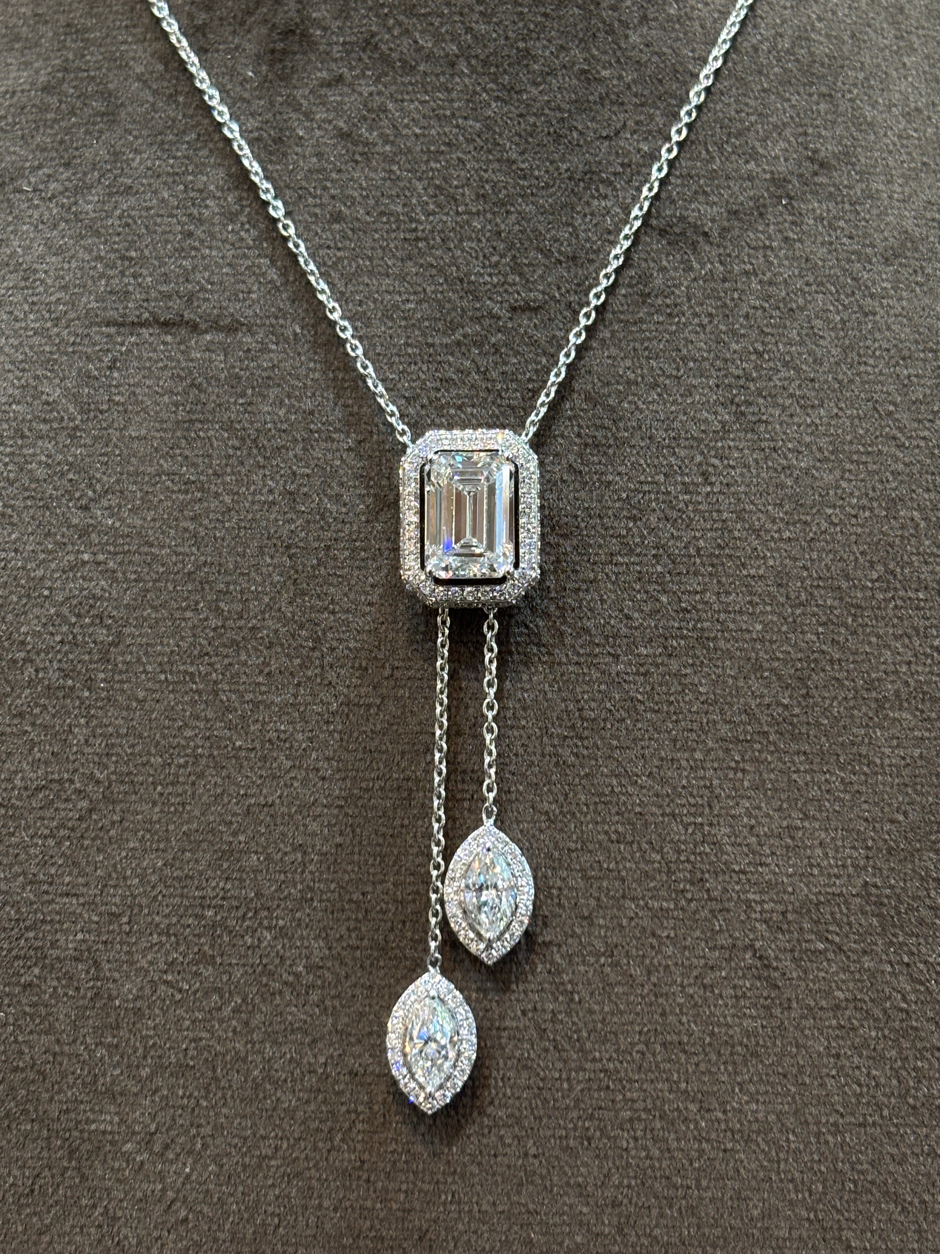 Close-up of Secret Halo Emerald Lab Diamond Chain Necklace in 18K White Gold by Fiona Diamonds