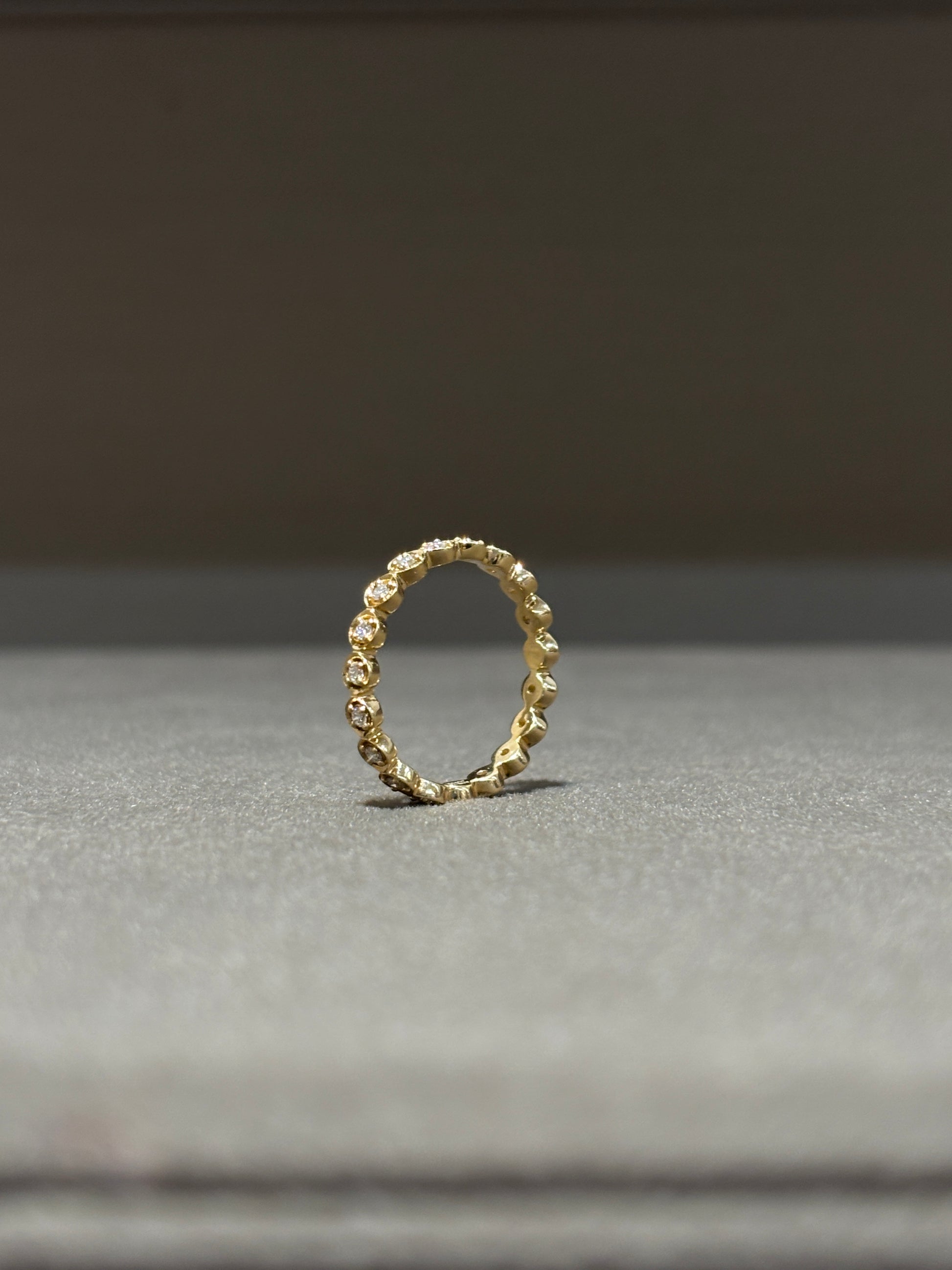 Elegant Wanyi Round Lab Diamond Eternity Ring in 18K Yellow Gold by Fiona Diamonds
