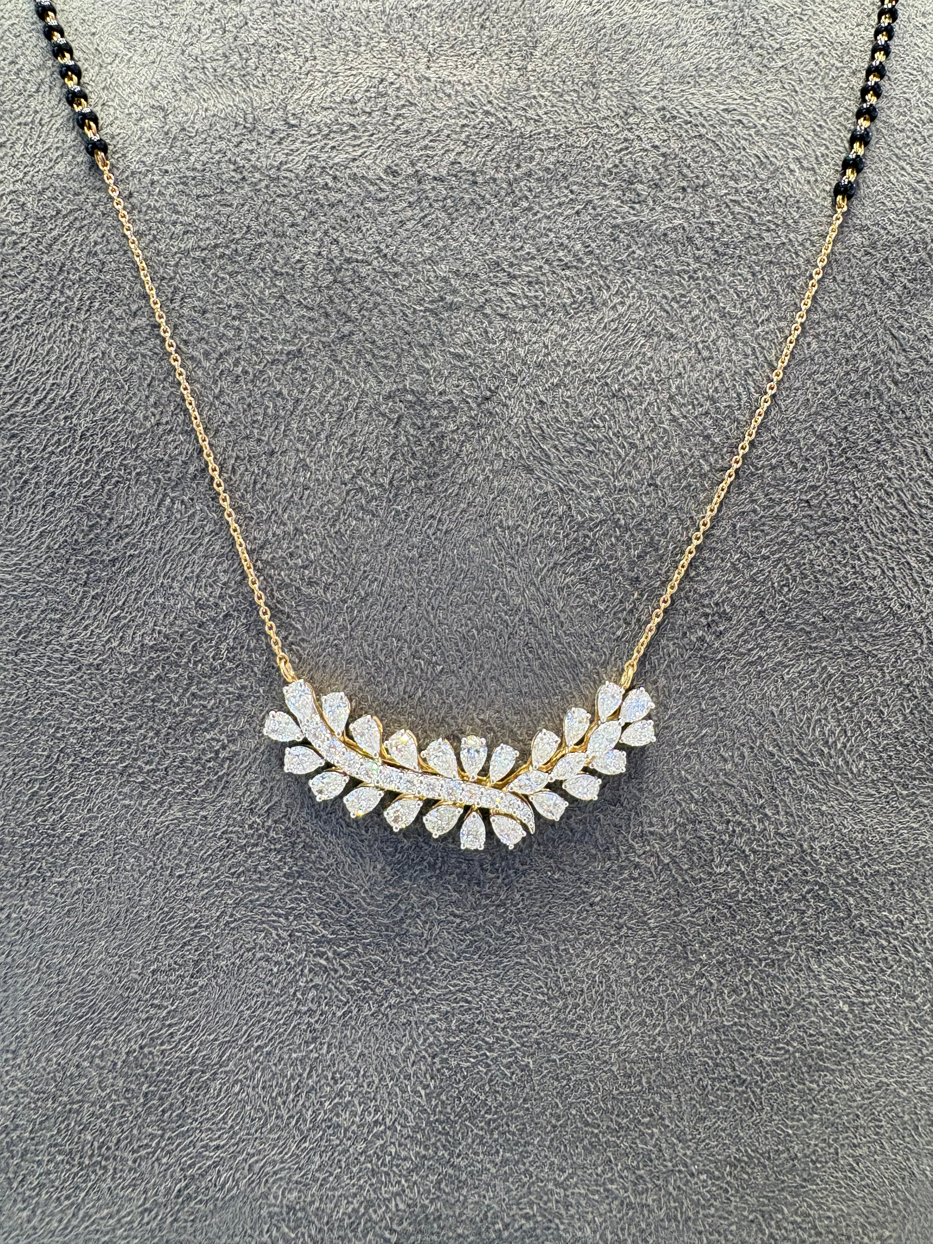 Close-up of Halcyon Rise Pear Lab Diamond Mangalsutra in 14K Yellow Gold by Fiona Diamonds