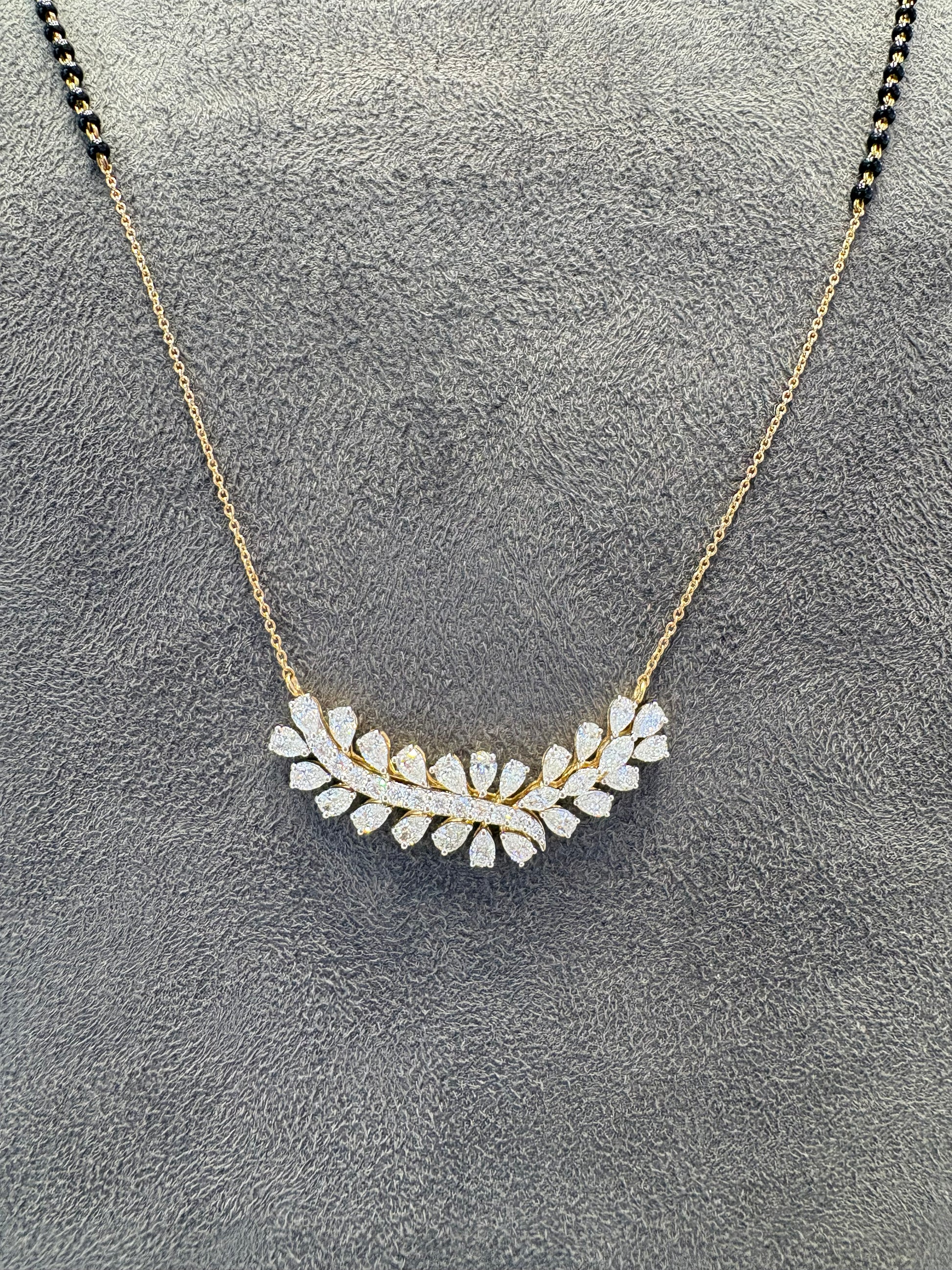 Close-up of Halcyon Rise Pear Lab Diamond Mangalsutra in 14K Yellow Gold by Fiona Diamonds