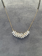 Close-up of Halcyon Rise Pear Lab Diamond Mangalsutra in 14K Yellow Gold by Fiona Diamonds