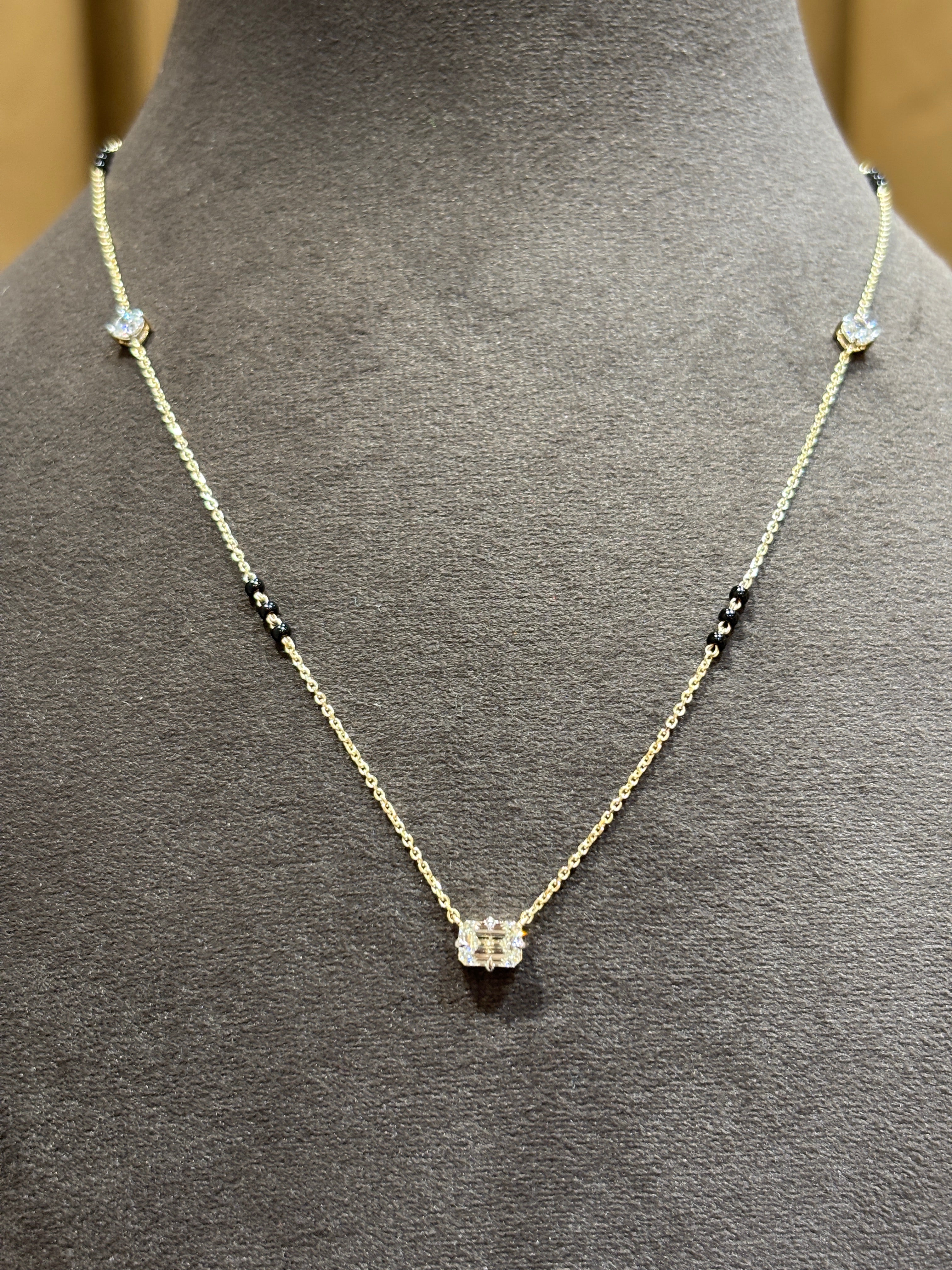 Close-up of Misty Zenith Emerald Lab Diamond Mangalsutra in 14K Yellow Gold by Fiona Diamonds
