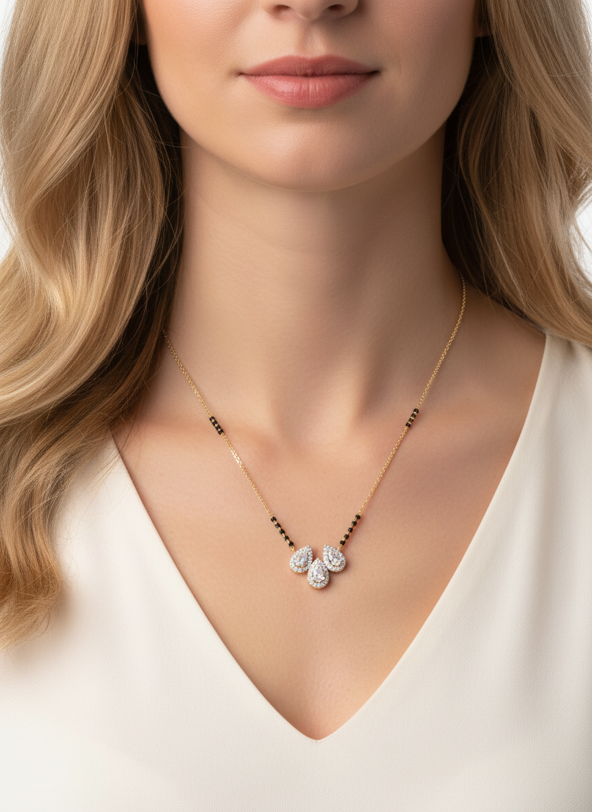 Close-up of Amavera Poise Pear Lab Diamond Mangalsutra in 14K Yellow Gold by Fiona Diamonds
