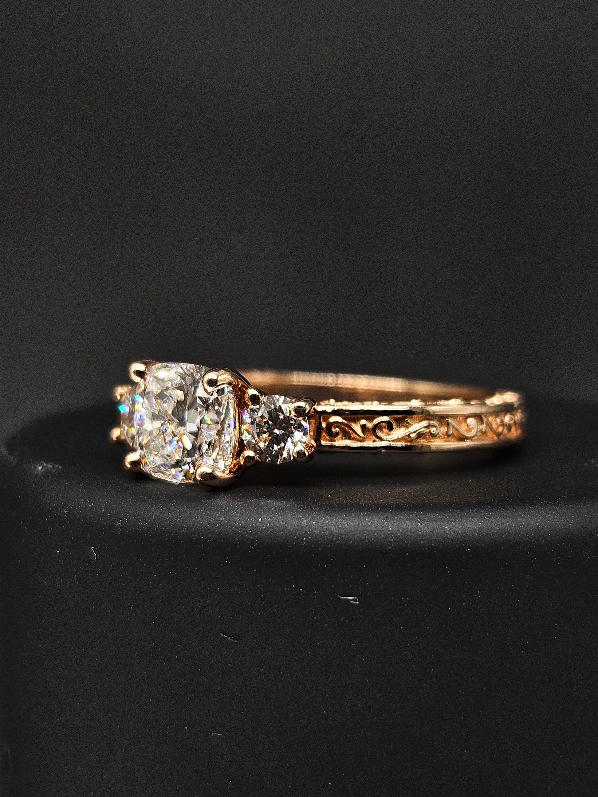 Fiona Diamonds Nova Lace Cushion Lab Diamond Three Stone Ring in 14K Rose Gold on hand