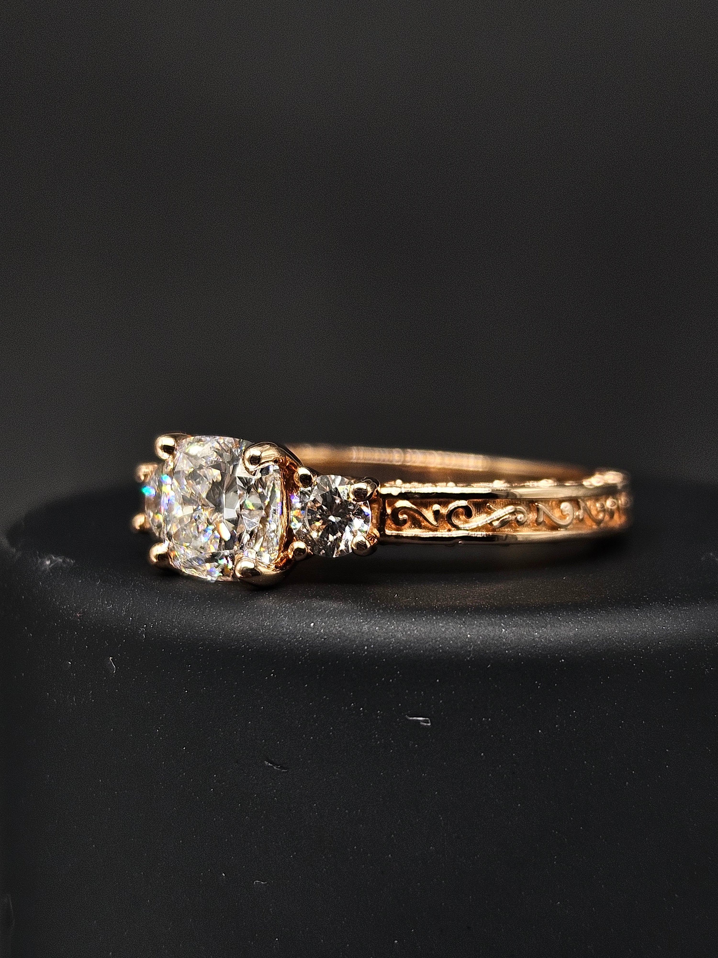 Fiona Diamonds Nova Lace Cushion Lab Diamond Three Stone Ring in 14K Rose Gold on hand