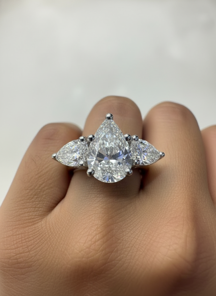 Side view of Ember Arch Pear Lab Diamond Three Stone Ring in 14K White Gold - Fiona Diamonds