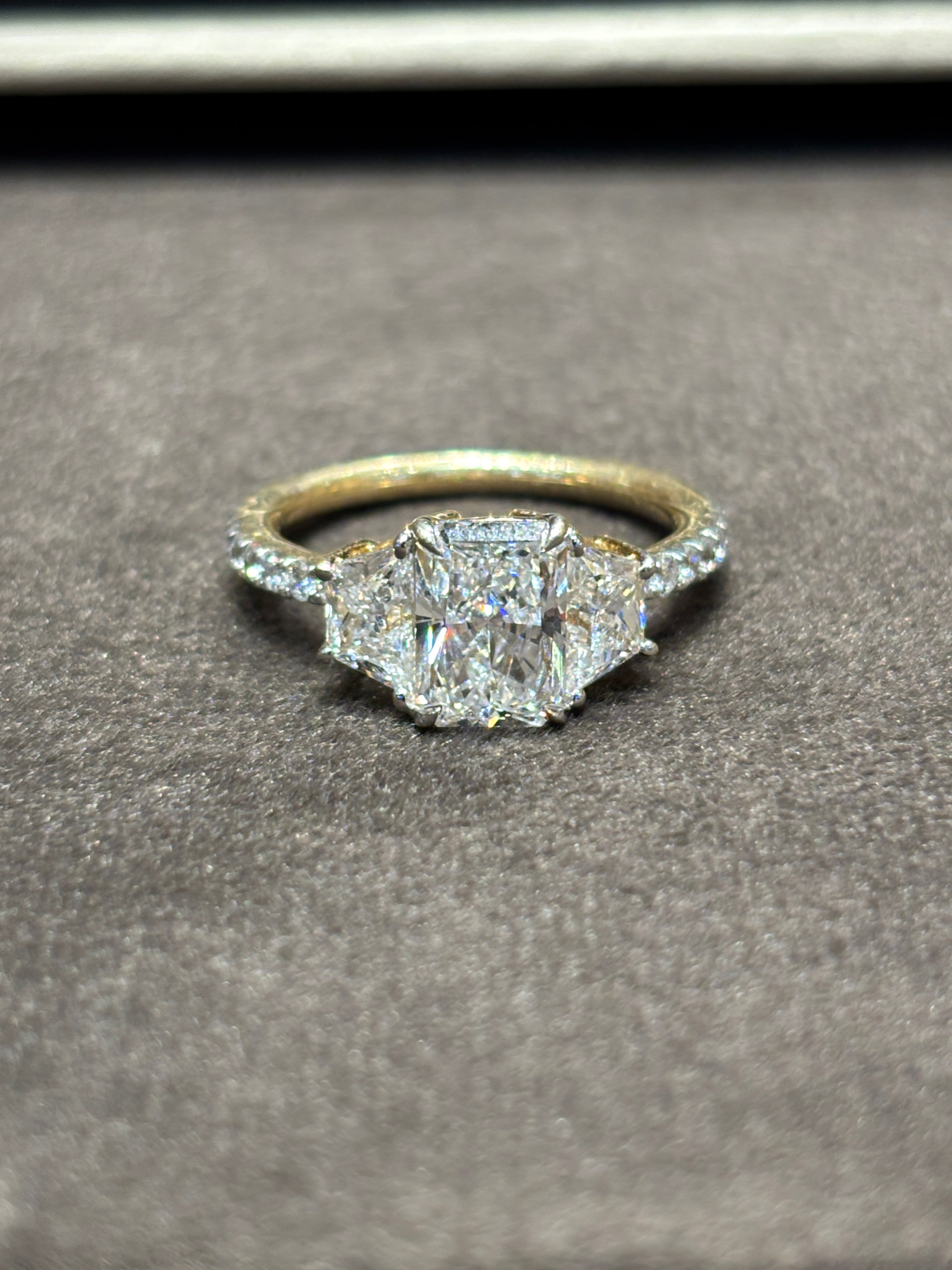 Close-up of Jovielle 1.5ct Radiant Lab Diamond Three Stone Ring set in 14K Yellow Gold by Fiona Diamonds