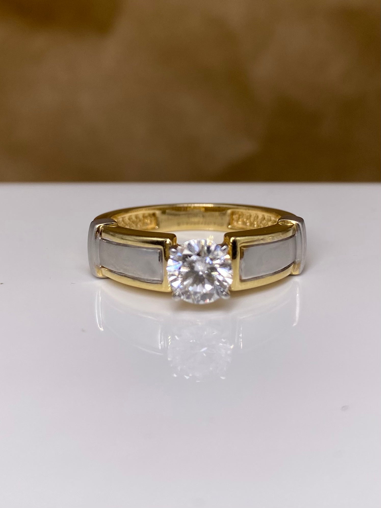 Close-up of 1ct Round Blush Ember Round Lab Diamond Classic Solitaire Ring set in 14K Yellow Gold by Fiona Diamonds
