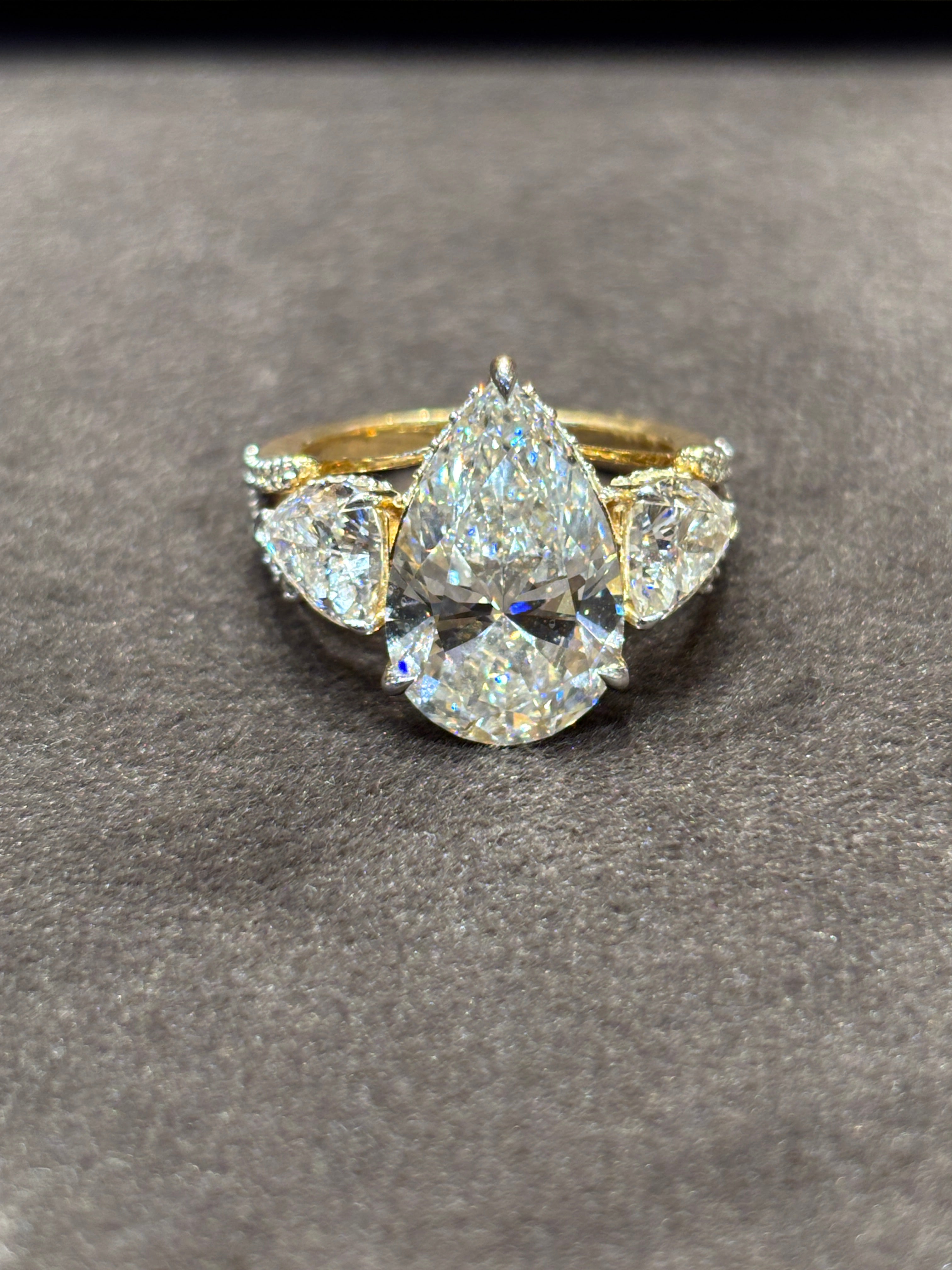 Side view of Eloura Bliss 5ct Pear Lab Diamond Three Stone Ring in 18K Yellow Gold - Fiona Diamonds
