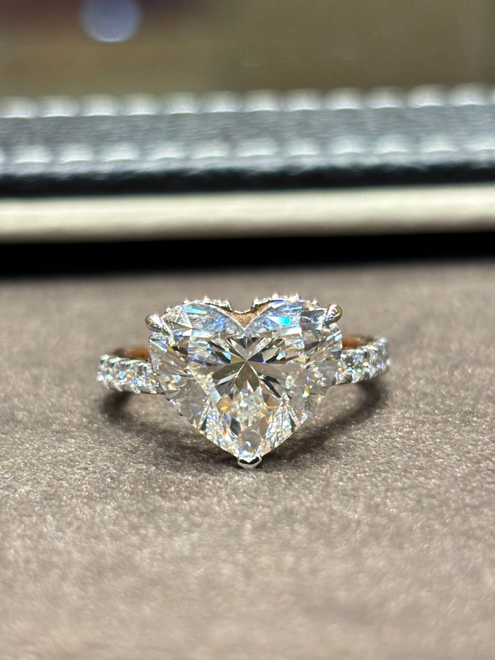 Close-up of Elandra 5ct Heart Lab Diamond Side Stone Solitaire Ring set in 18K Rose Gold by Fiona Diamonds