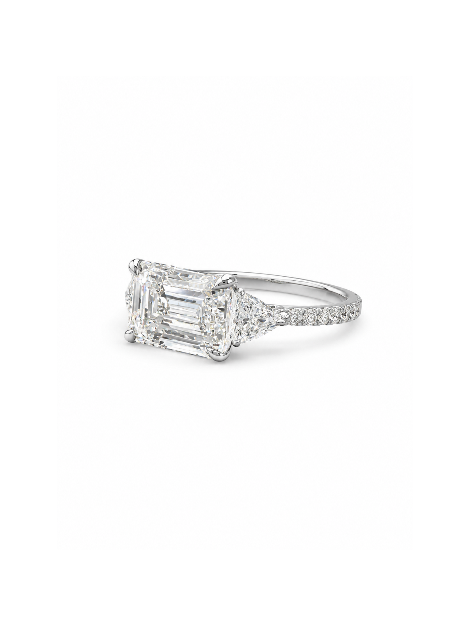 Close-up of Brielle Crest Emerald Lab Diamond Three Stone Ring set in 18K Yellow Gold by Fiona Diamonds