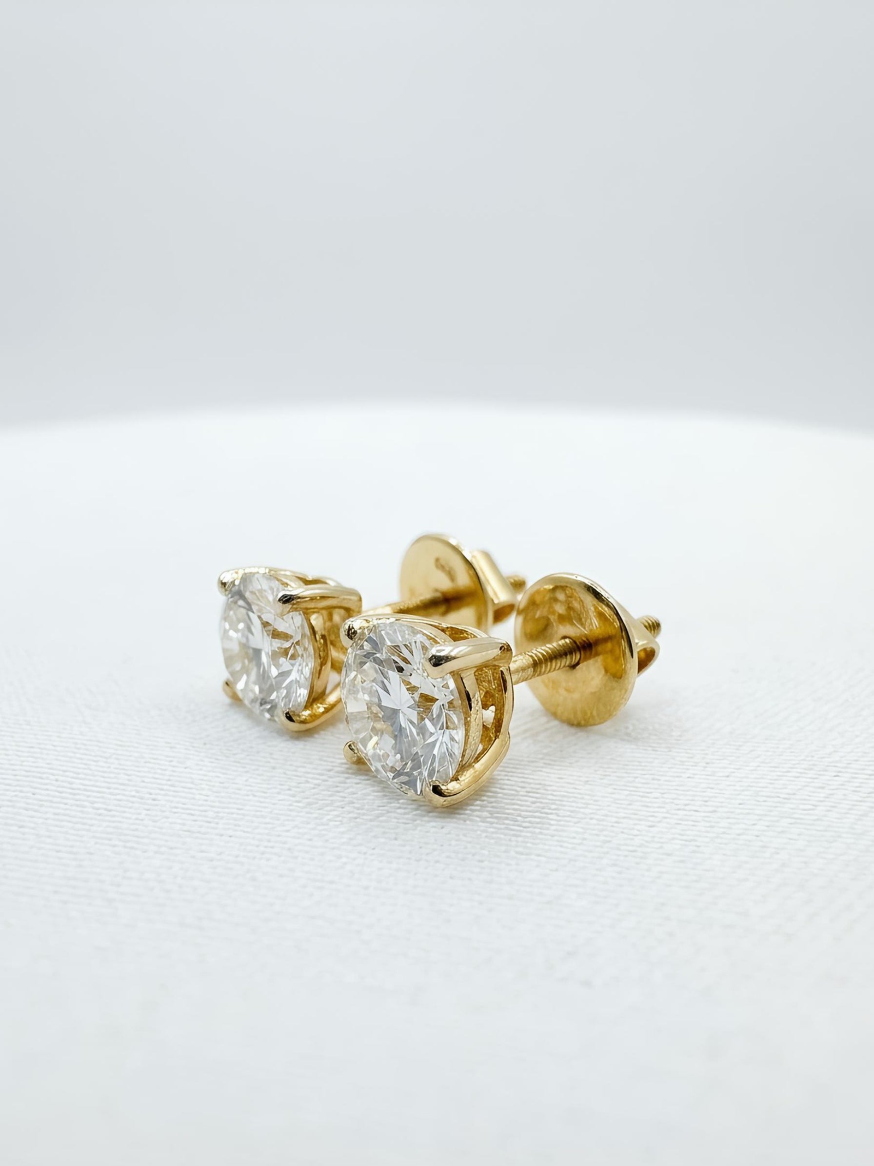 Close-up of Elowen Mist Round Lab Diamond Solitaire Stud in 18K Yellow Gold by Fiona Diamonds