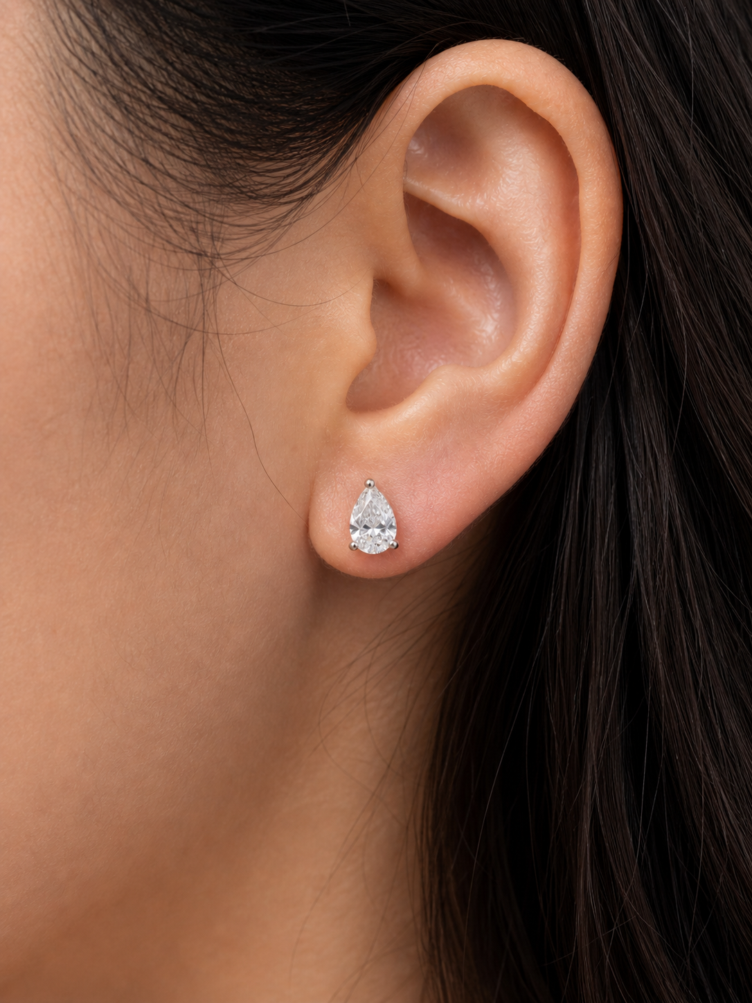 Side view of Ulara Crest Pear Lab Diamond Stud Earrings in 18K Yellow Gold - Fiona Diamonds