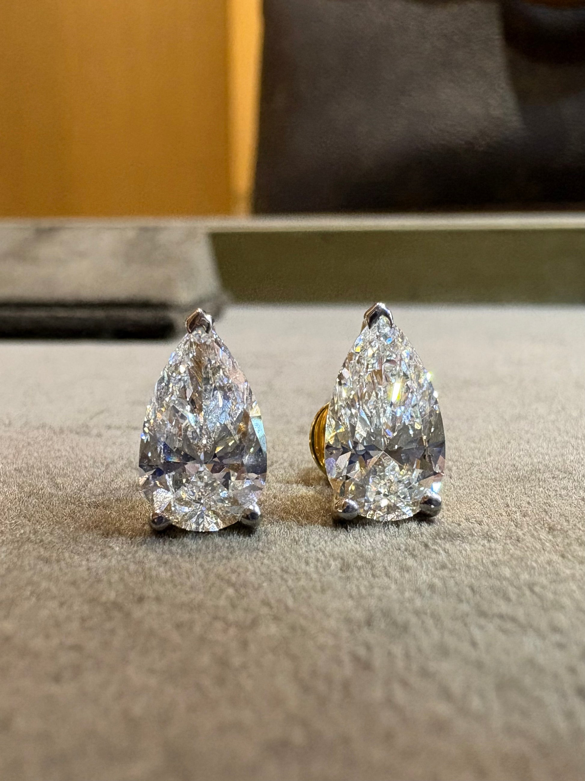 Fiona Diamonds Ulara Crest Pear Lab Diamond Stud Earrings in 18K Yellow Gold on ear