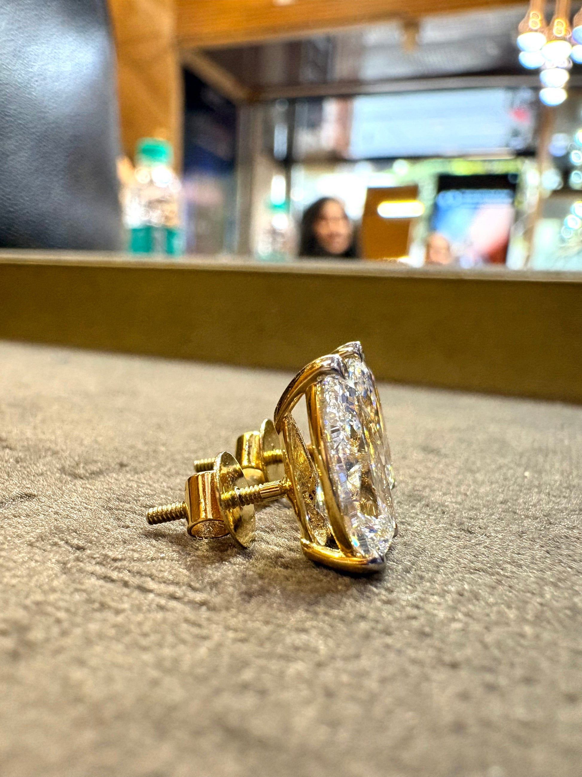 Top view of Ulara Crest Pear Lab Diamond Stud Earrings in 18K Yellow Gold - Fiona Diamonds
