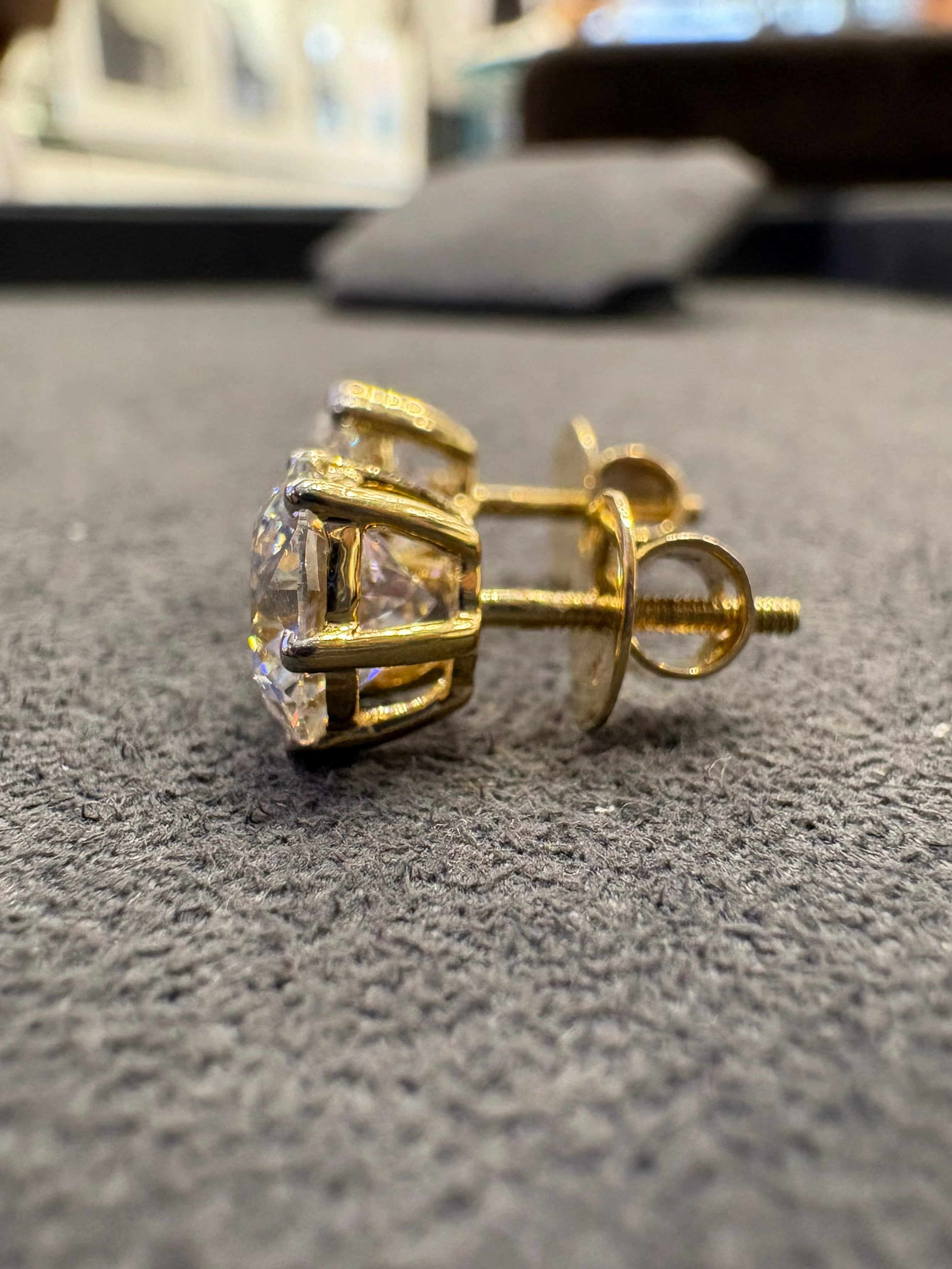 Close-up of Bexley Flare Round Lab Diamond Solitaire Stud in 18K Yellow Gold by Fiona Diamonds