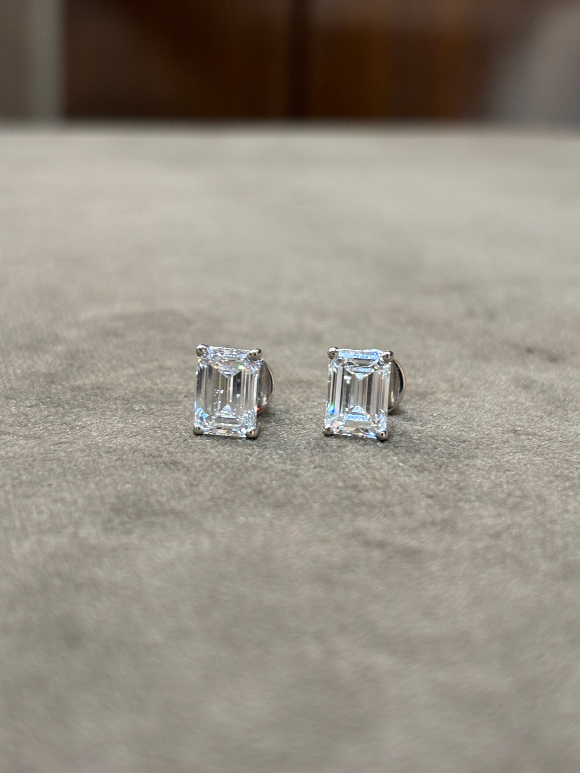 Close-up of 2ct Emerald Emerald Lab Diamond Solitaire Stud in 18K White Gold by Fiona Diamonds