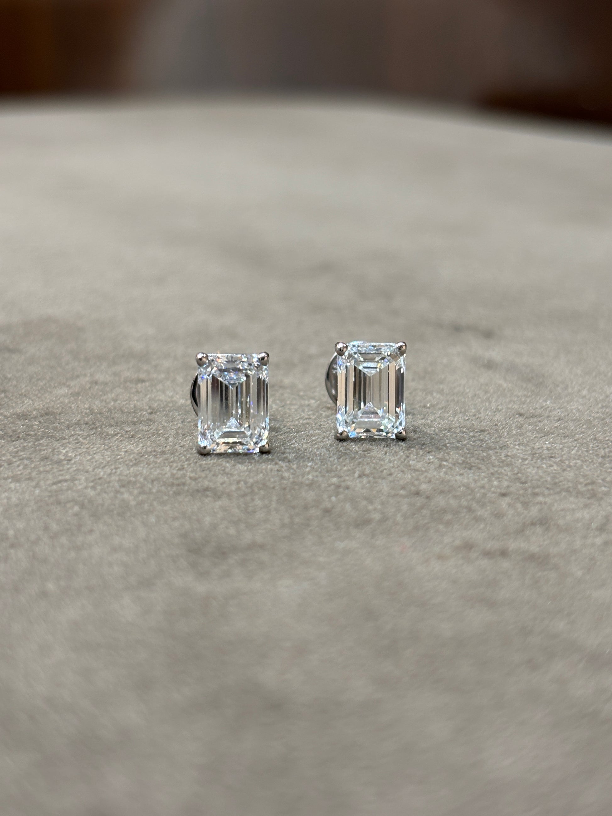 Side view of 2ct Emerald Emerald Lab Diamond Stud Earrings in 18K White Gold - Fiona Diamonds