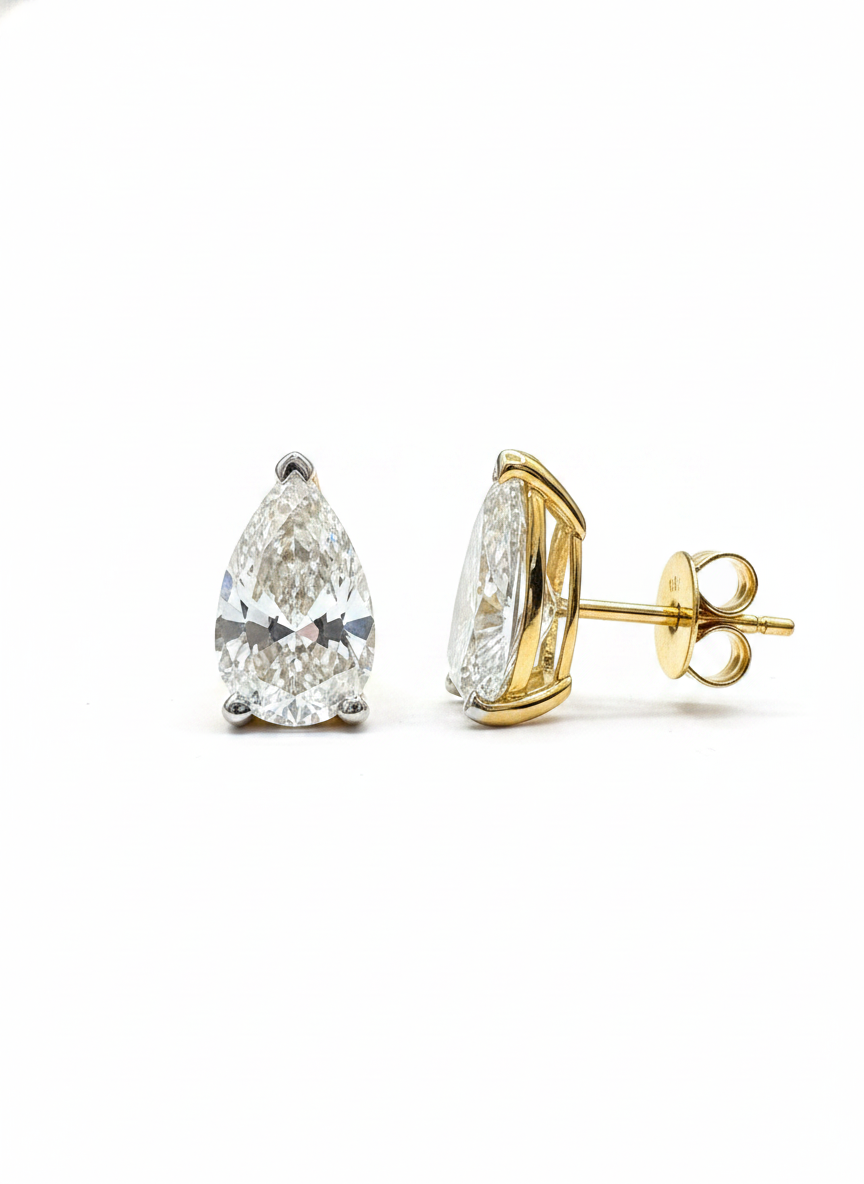 Close-up of Xariel Lune Pear Lab Diamond Solitaire Stud in 18K Yellow Gold by Fiona Diamonds