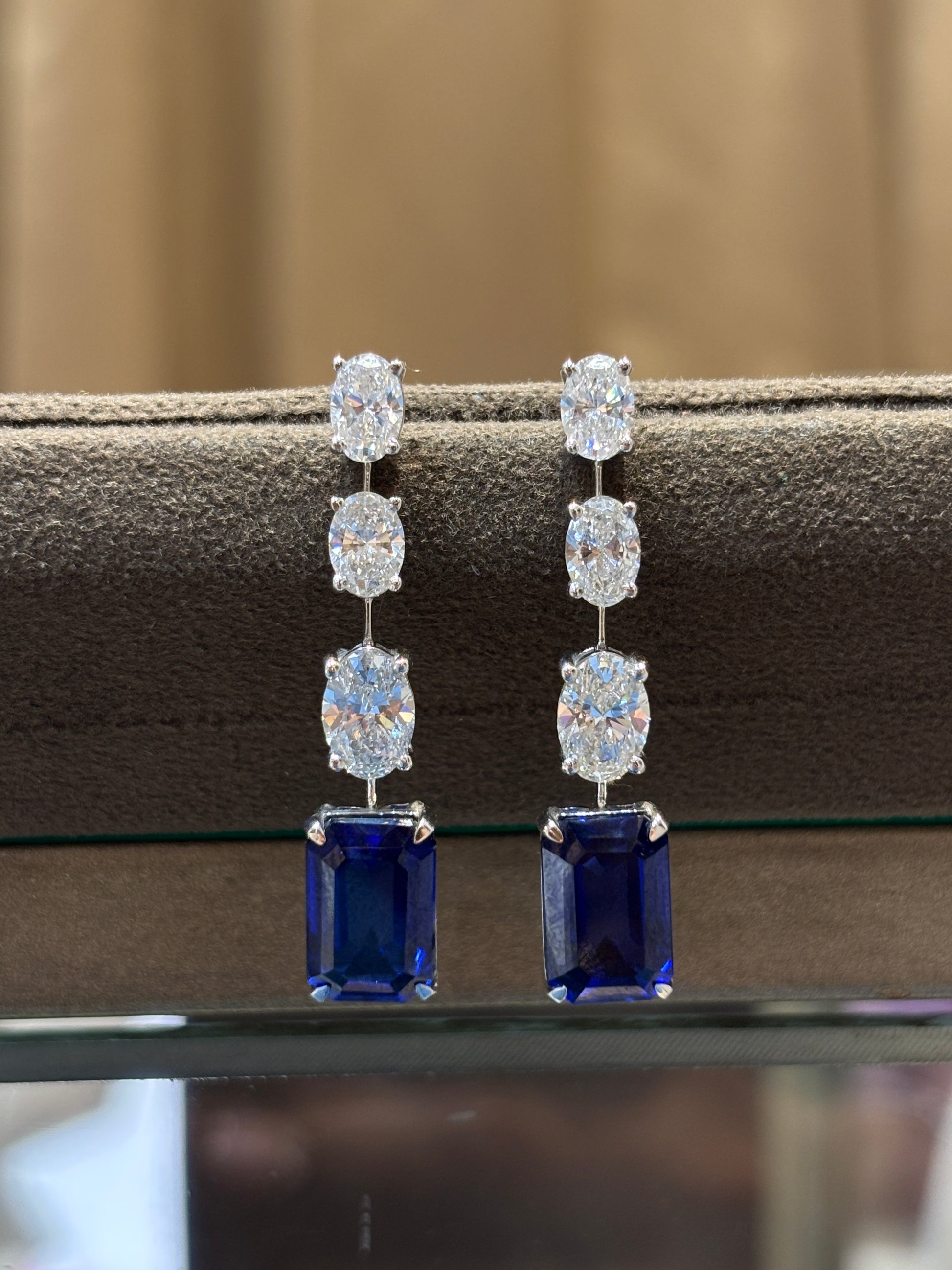 Close-up of Ember Serenity Oval Lab Diamond Dangler Earrings in 14K White Gold by Fiona Diamonds