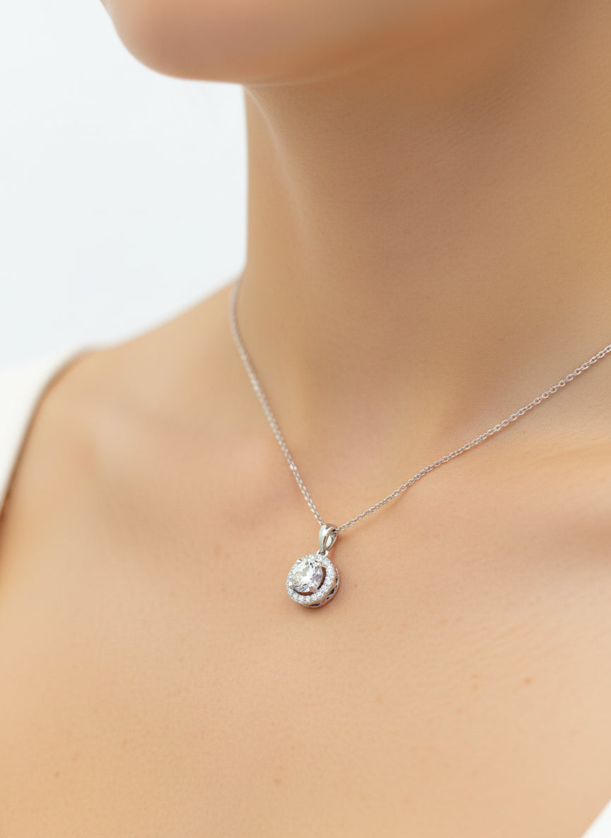 Close-up of Stella Mirage Round Lab Diamond Halo Pendant in 18K White Gold by Fiona Diamonds