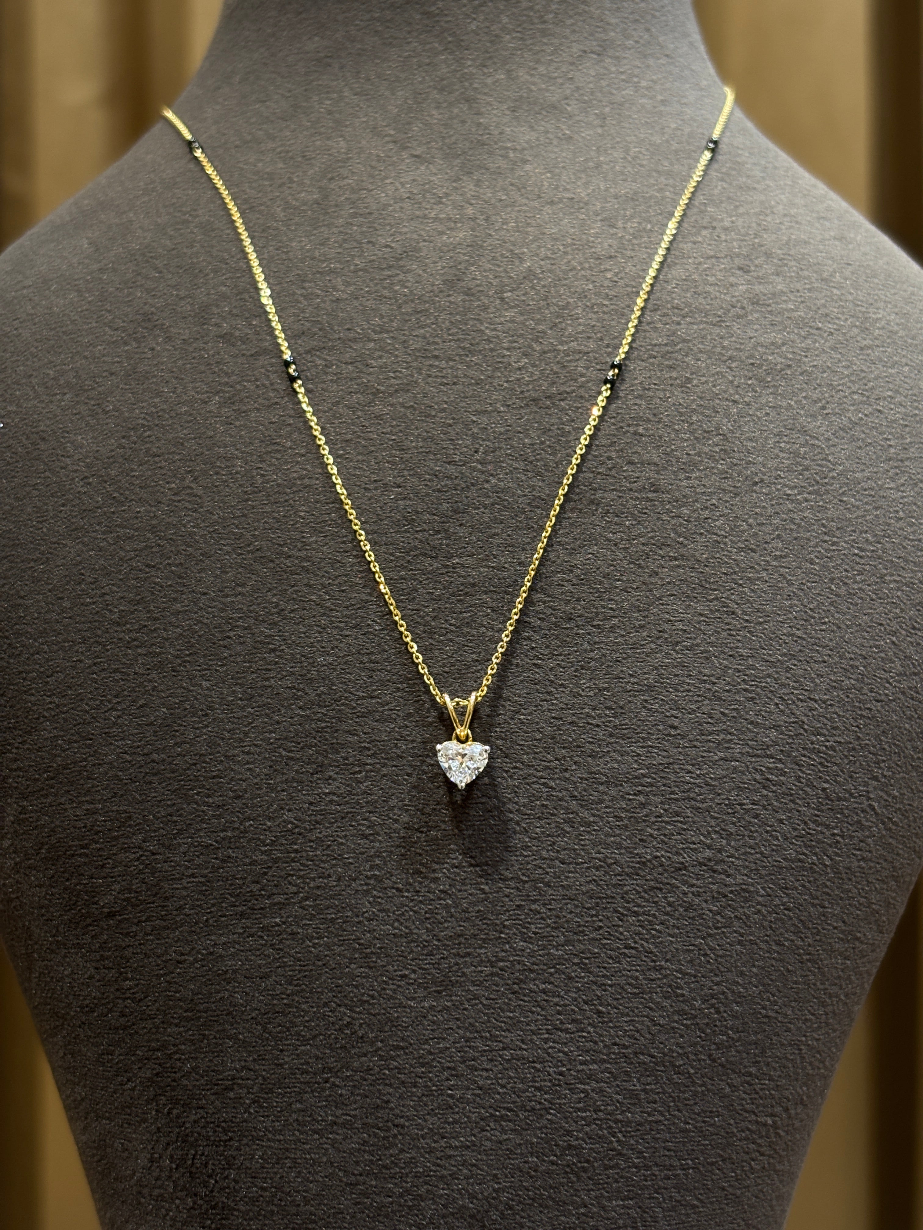 Top view of Serene Solstice Heart Lab Diamond Mangalsutra in 14K Yellow Gold - Fiona Diamonds