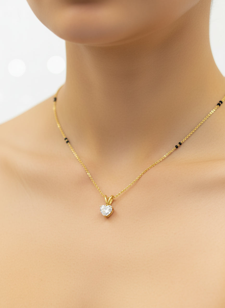 Close-up of Serene Solstice Heart Lab Diamond Mangalsutra in 14K Yellow Gold by Fiona Diamonds