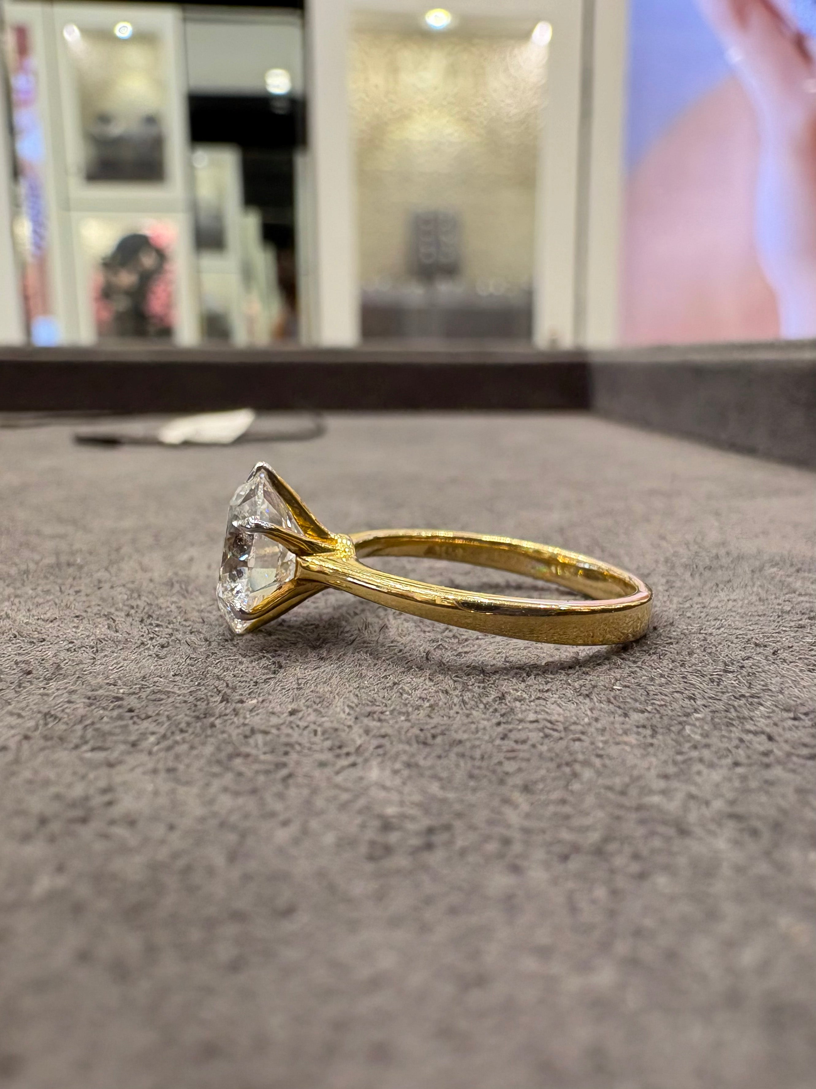 Close-up of Juniper Cove Round Lab Diamond Classic Solitaire Ring set in 14K Yellow Gold by Fiona Diamonds