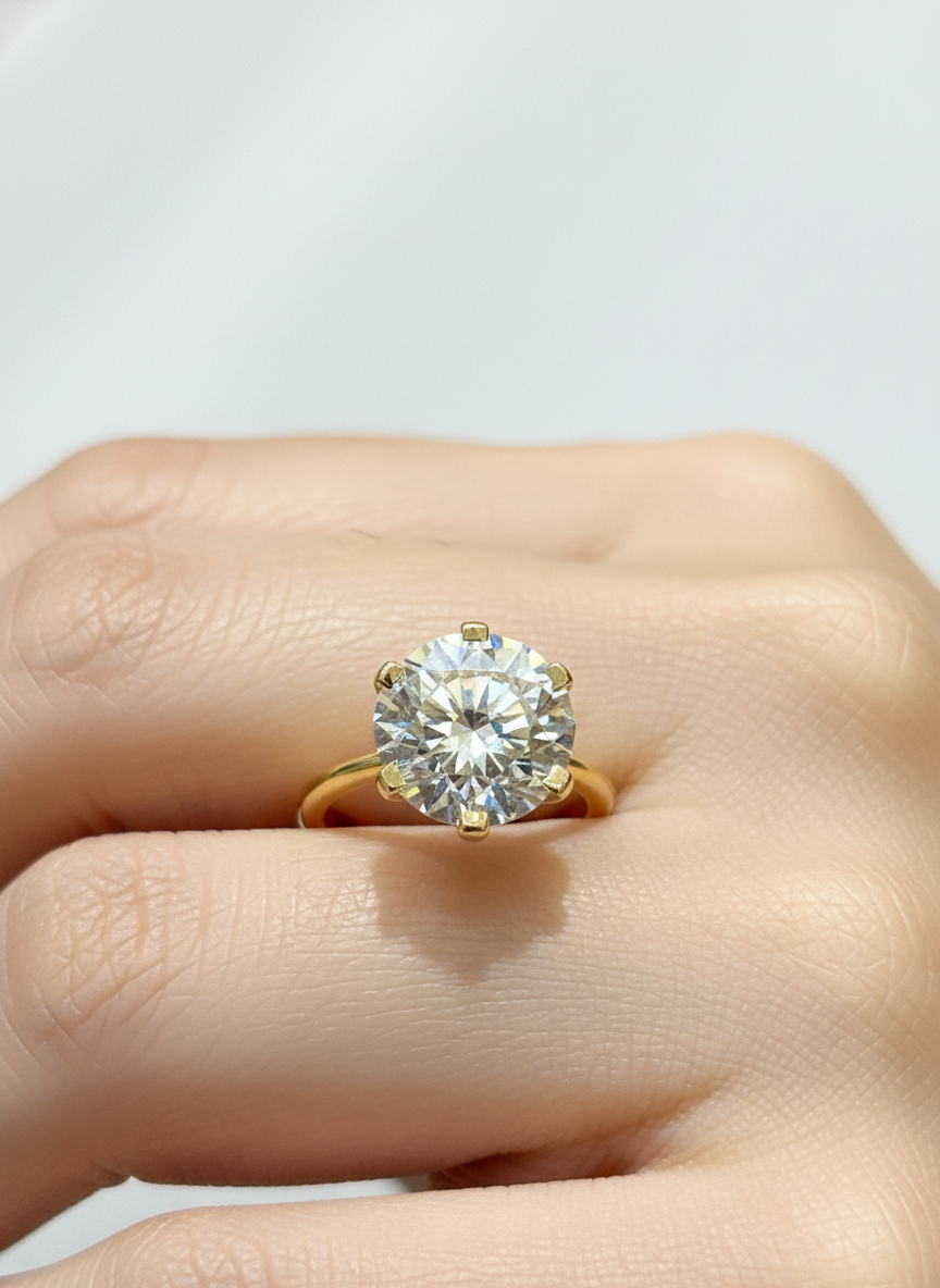 Close-up of Aurora Muse Round Lab Diamond Classic Solitaire Ring set in 18K Yellow Gold by Fiona Diamonds