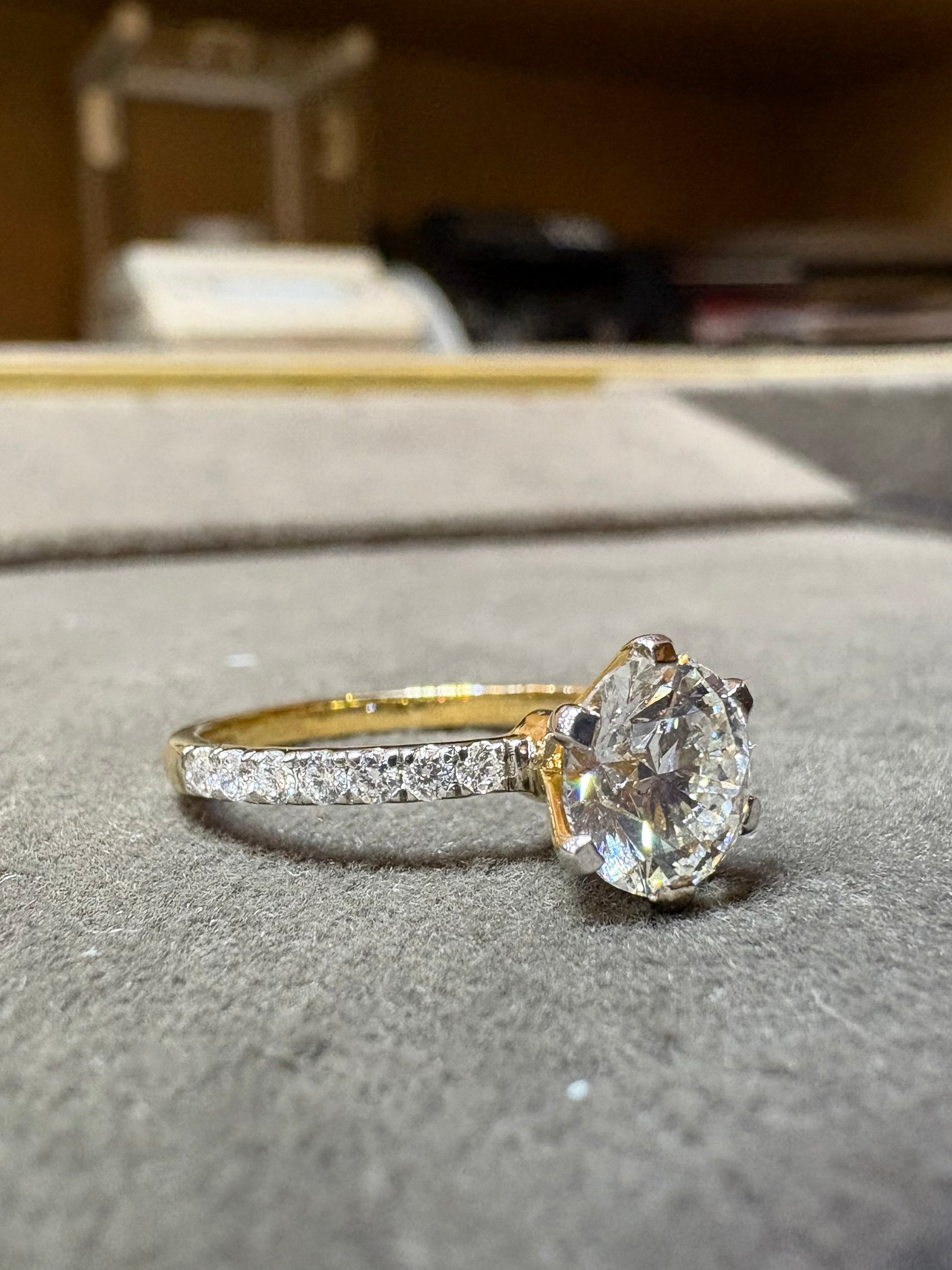 Fiona Diamonds Kaelith Lace Round Lab Diamond Side Stone Solitaire Ring in 18K Yellow Gold on hand